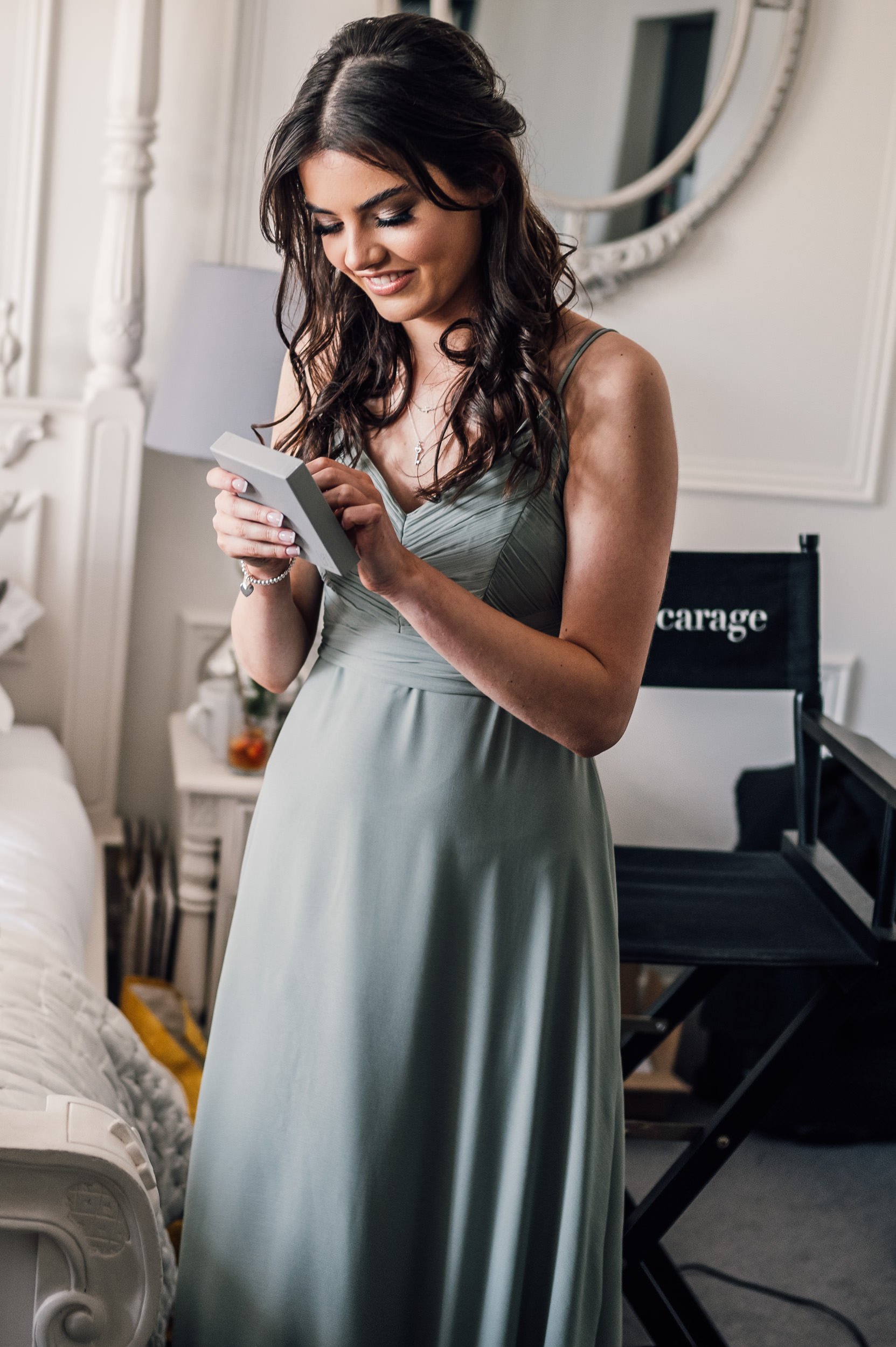 bridesmaid putting on a bracelet