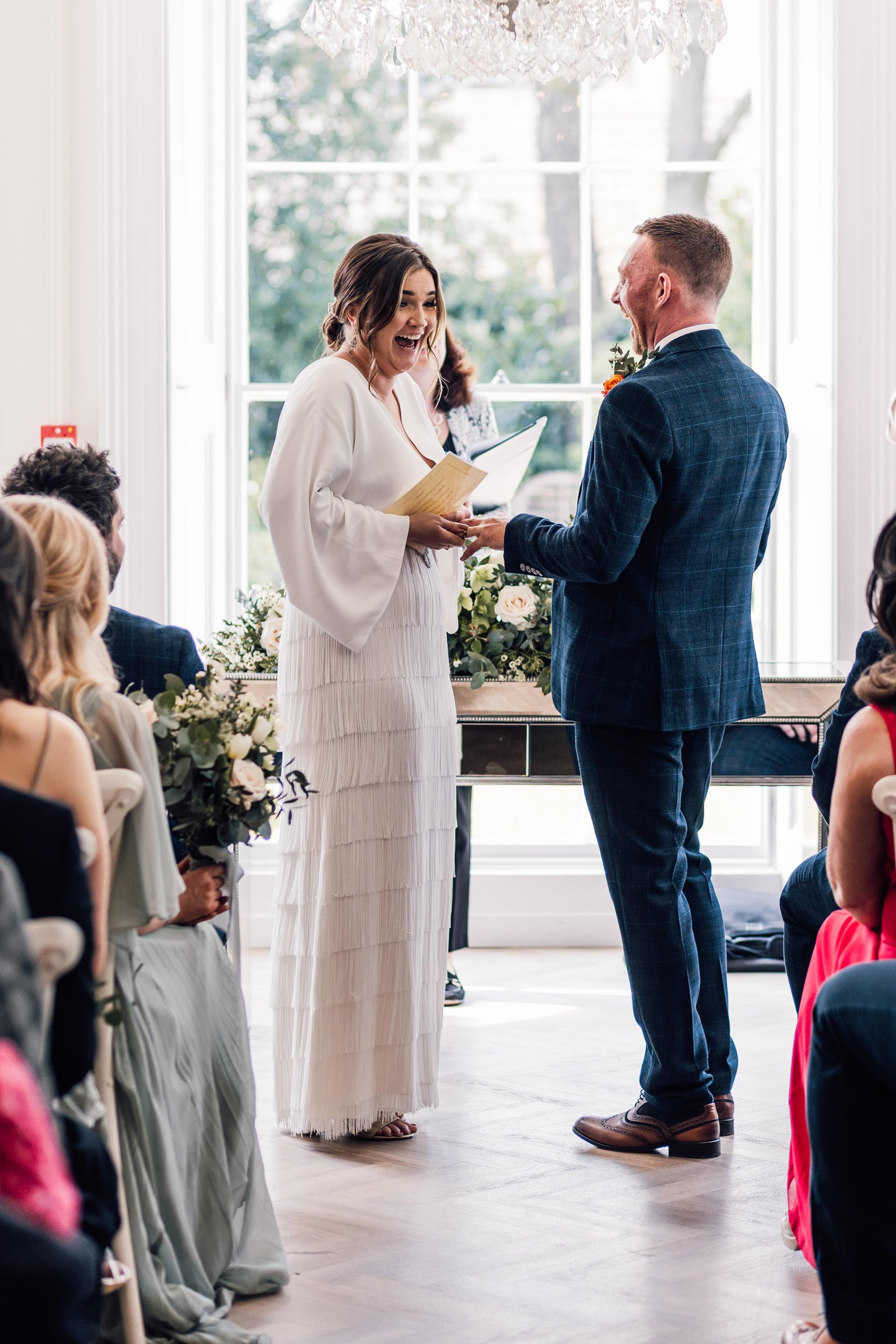 bride and groom sharing a joke