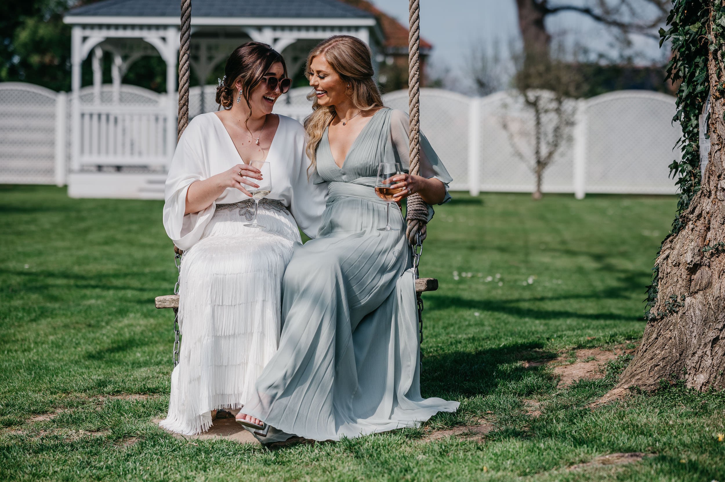 bride and maid of honor having a laugh