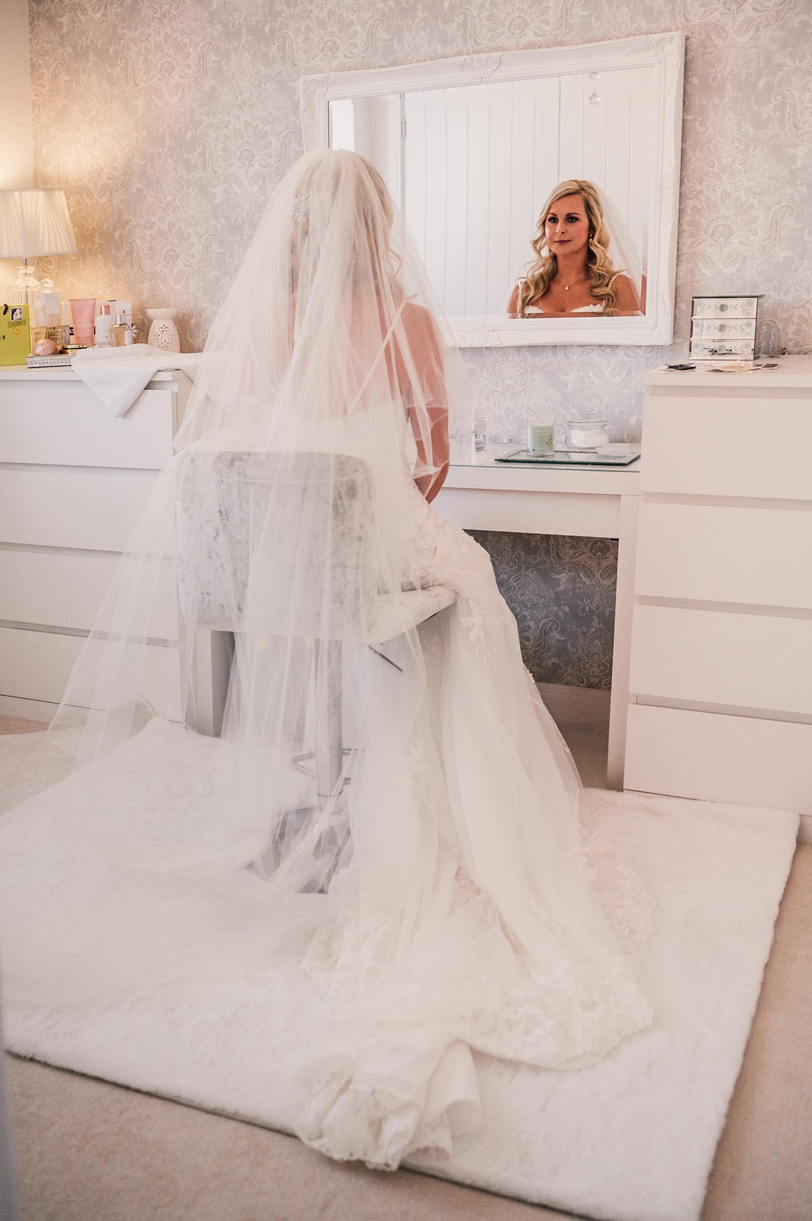 bride looking in a mirror