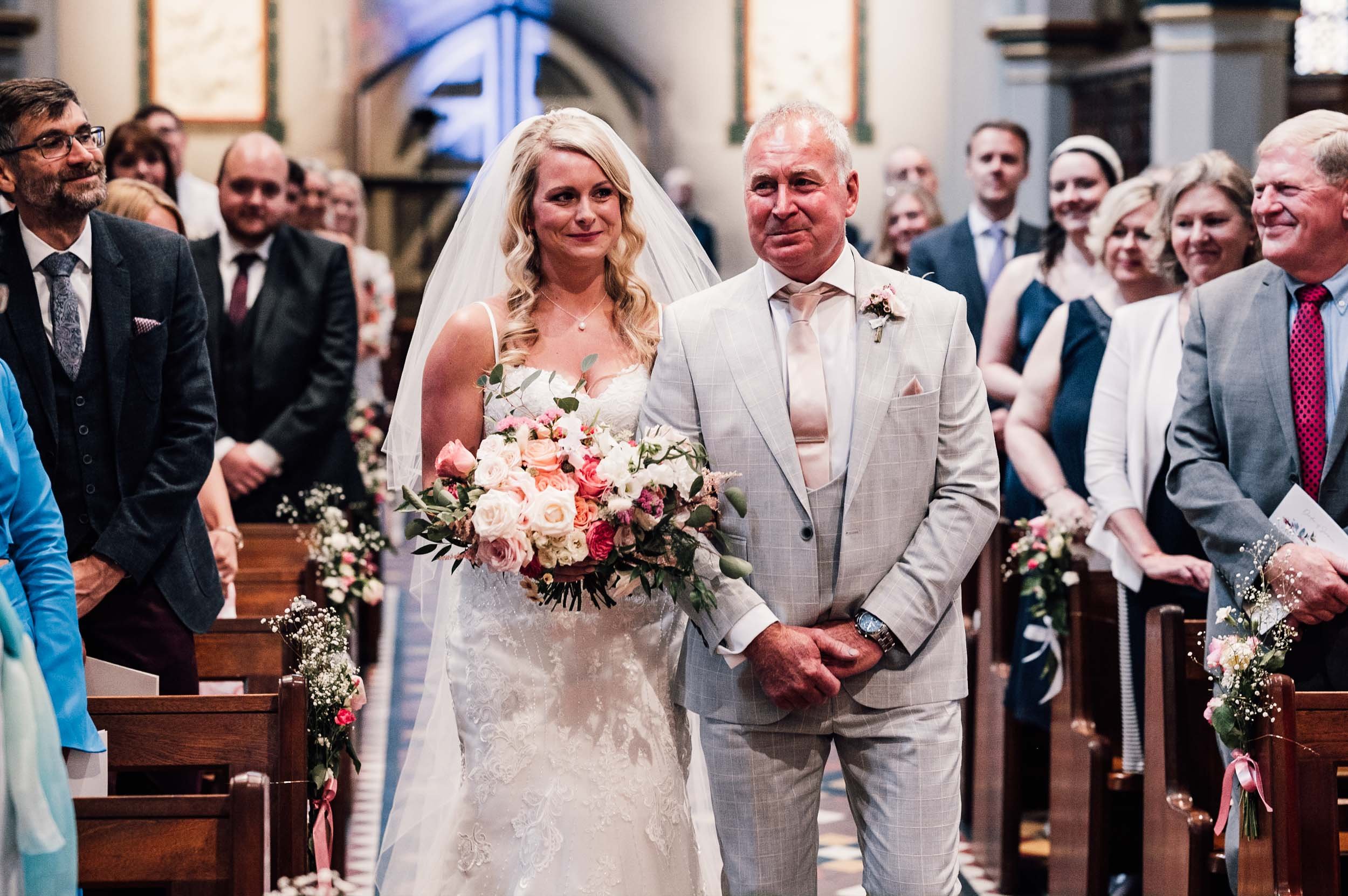 father and bride walk down the aisle at St Barnabas cathedral