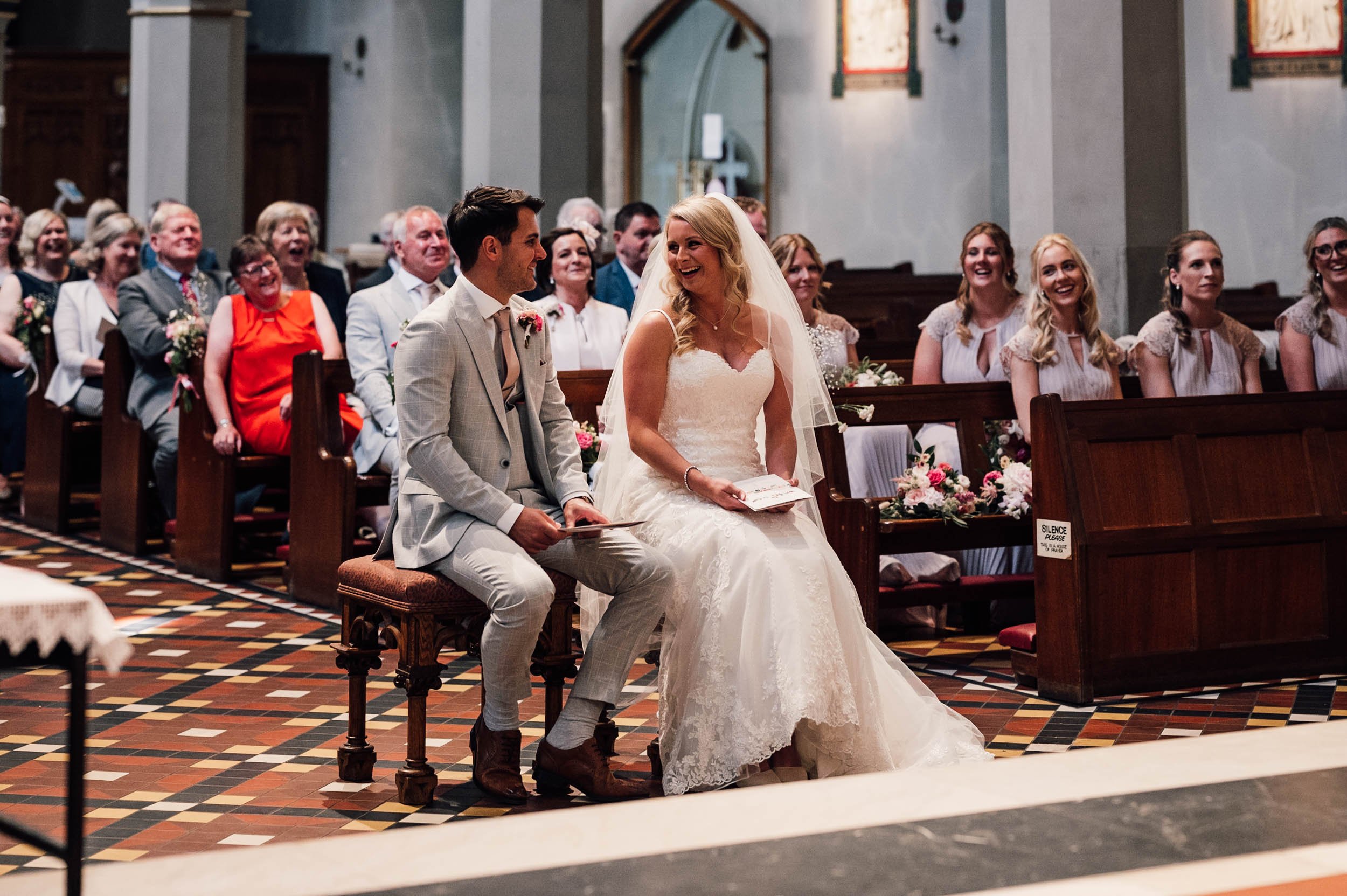 bride and groom laughing during the wedding ceremony