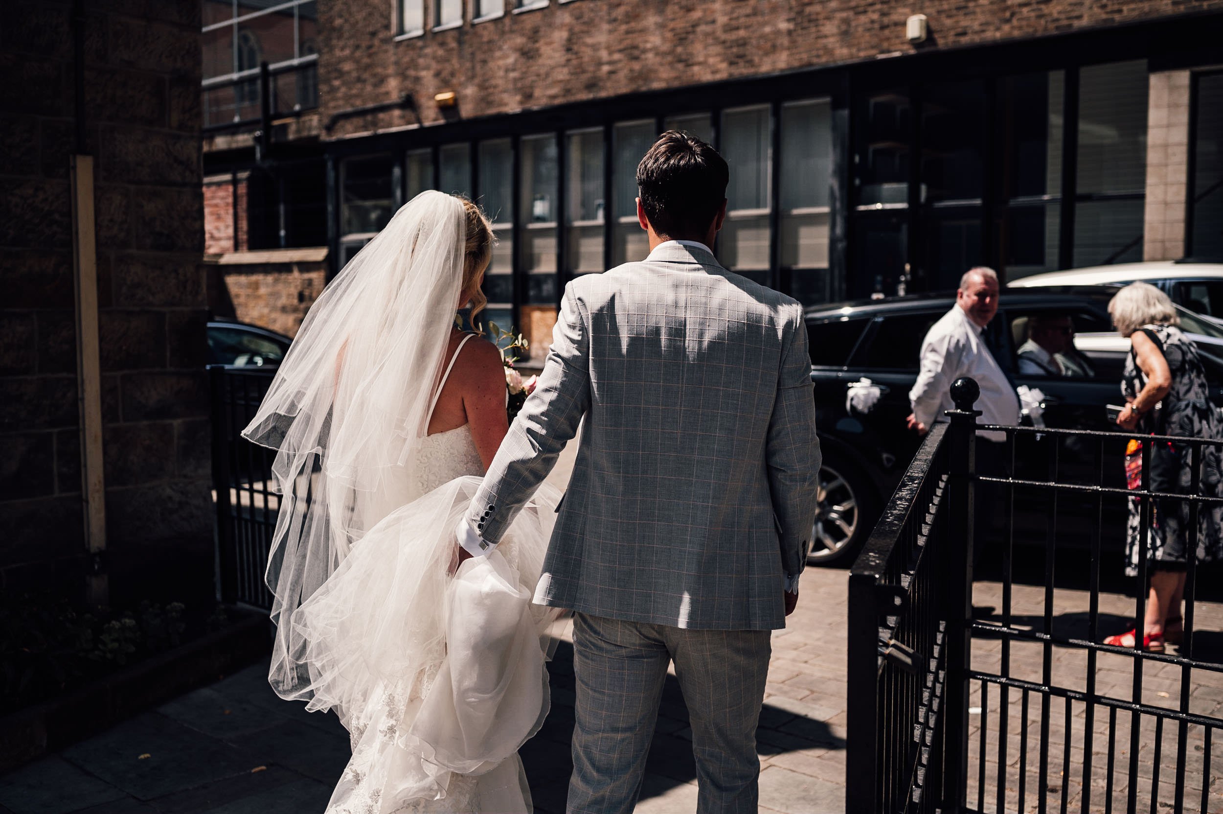bride and groom leave church