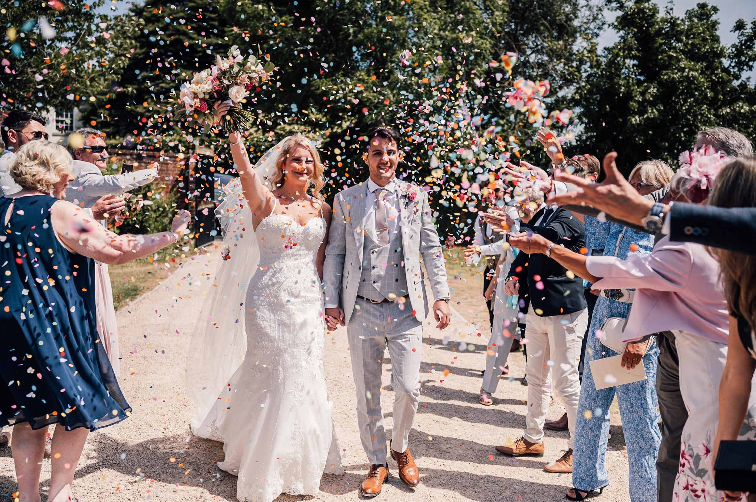 bride and groom confetti walk