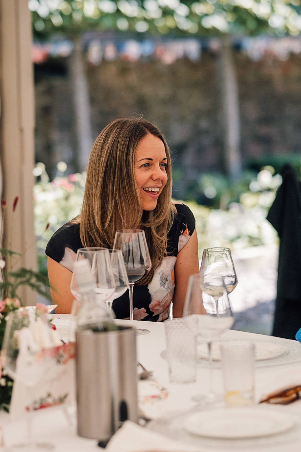 wedding guests laughing at the speeches