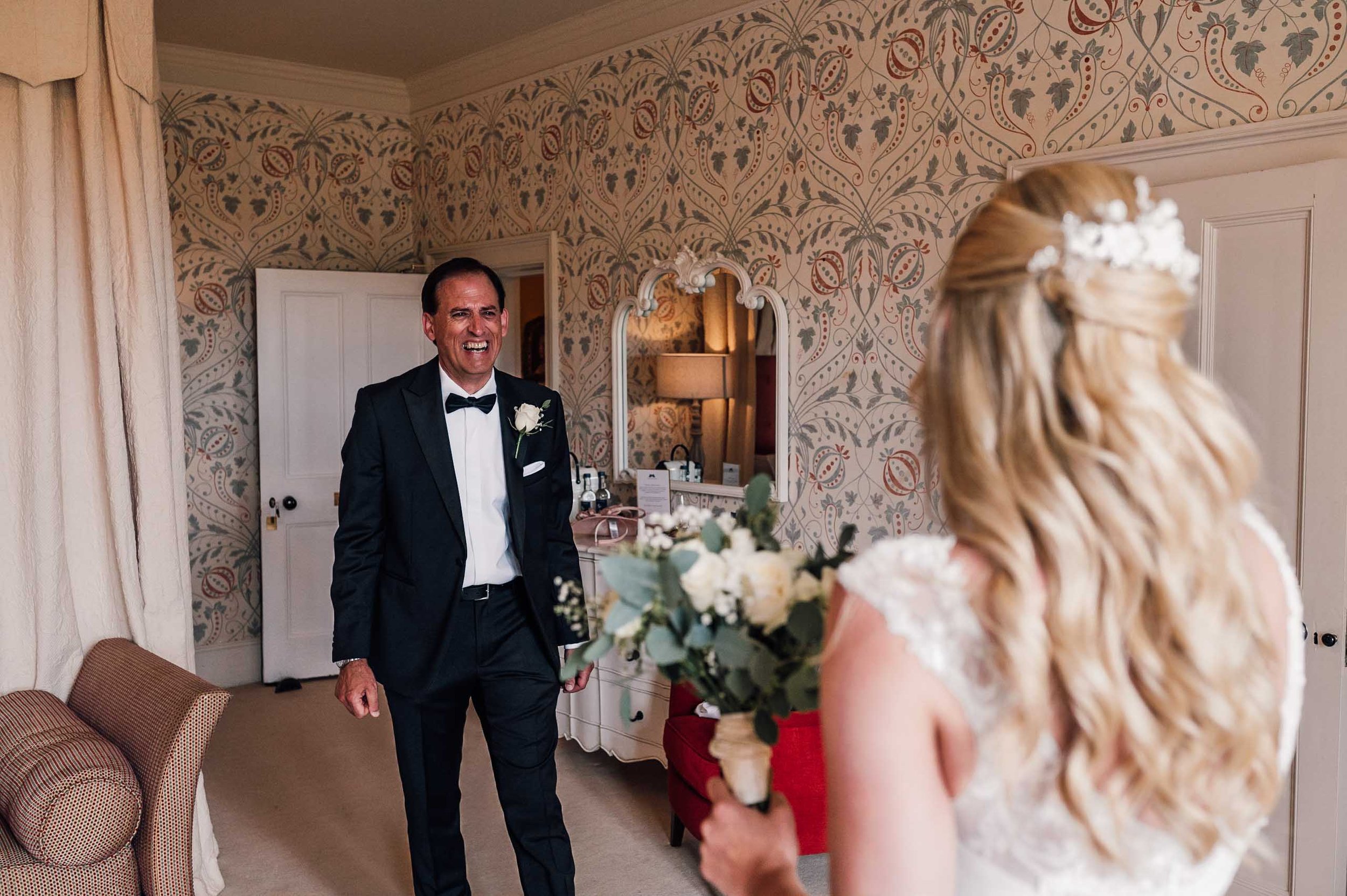 bride and her father first look in the bridal suite at Hodsock Priory