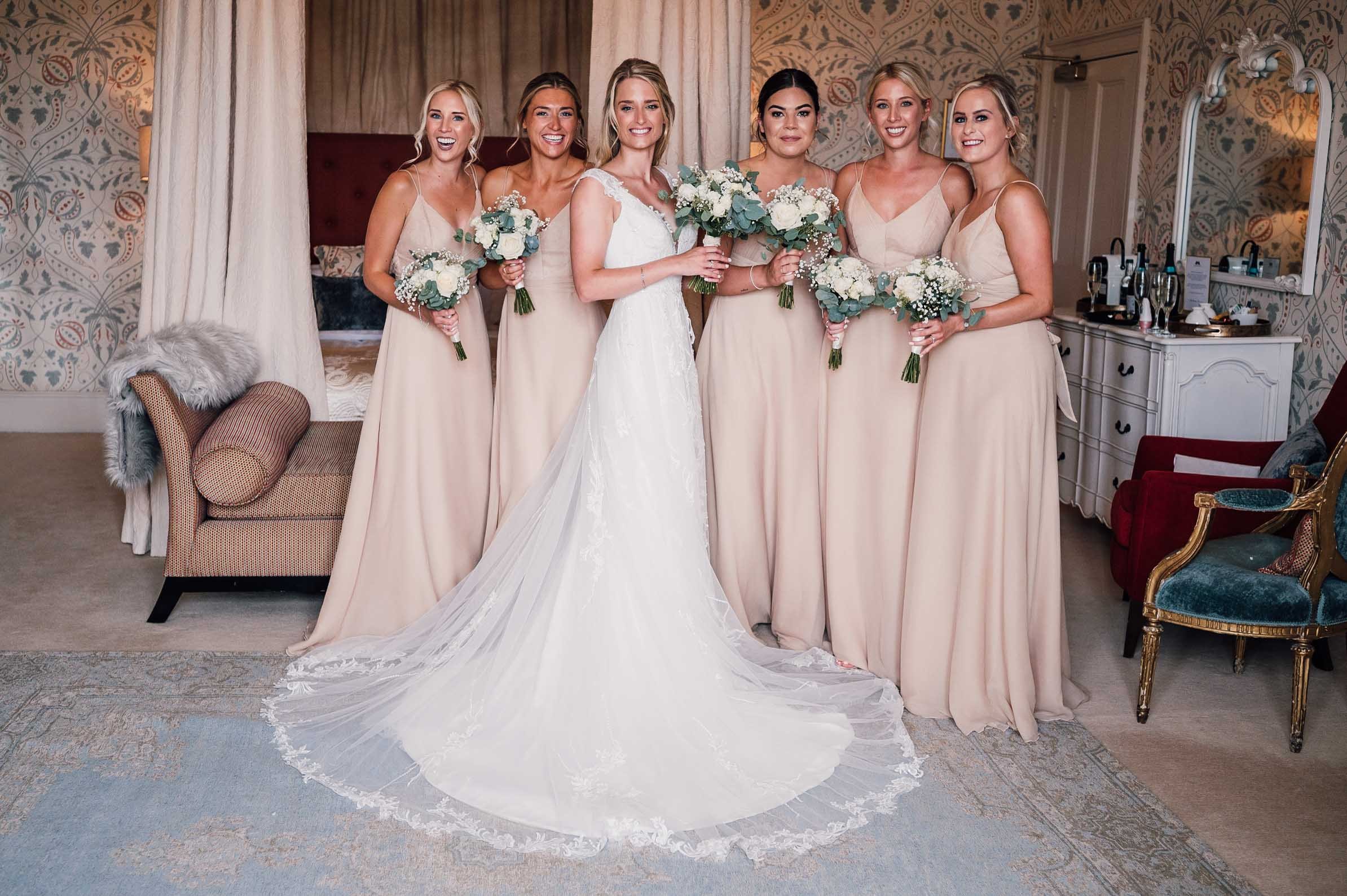 Portrait of the bride and her bridesmaids at Hodsock Priory