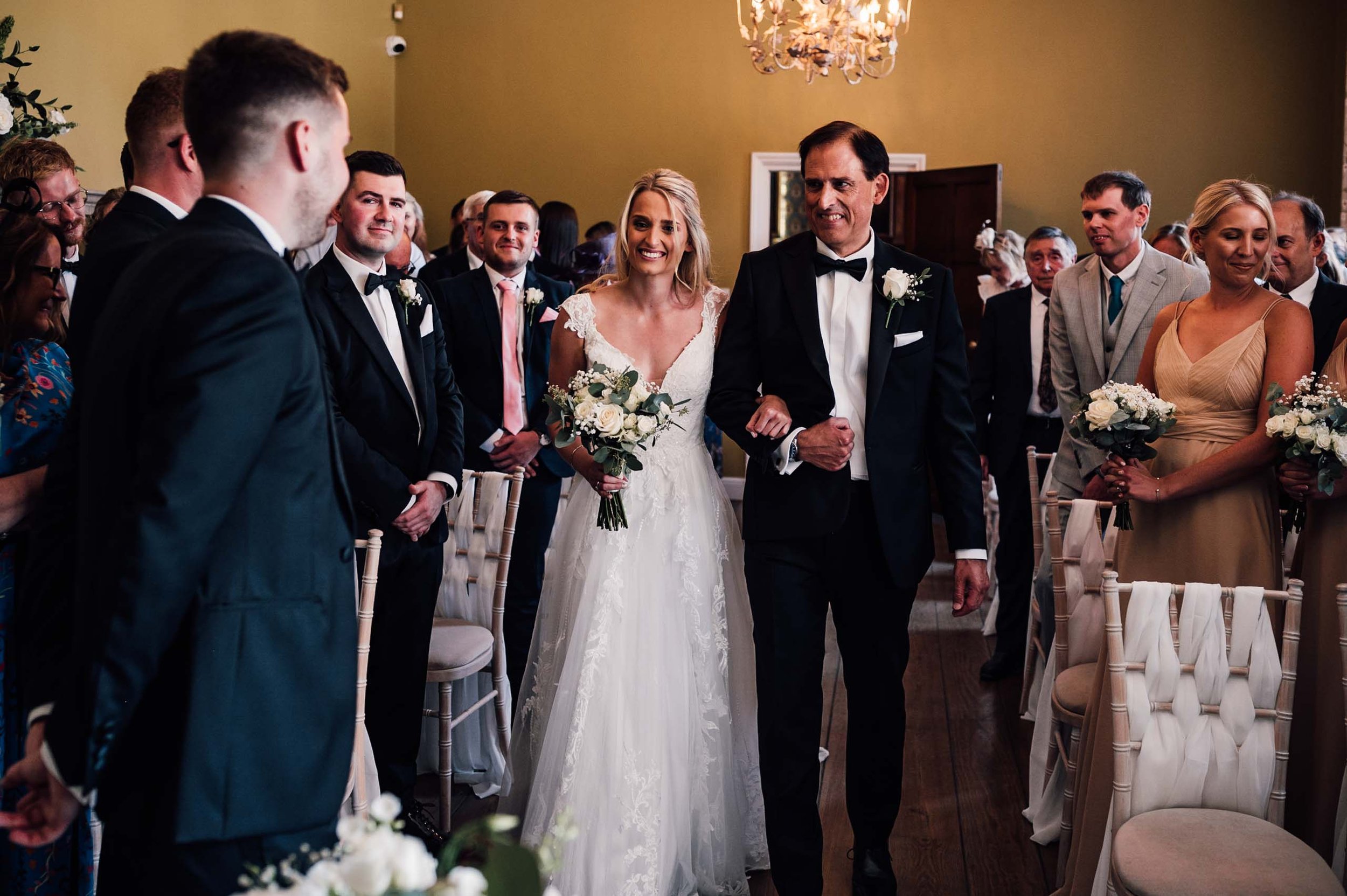 Bride and her father walk down the aisle at Hodsock Priory