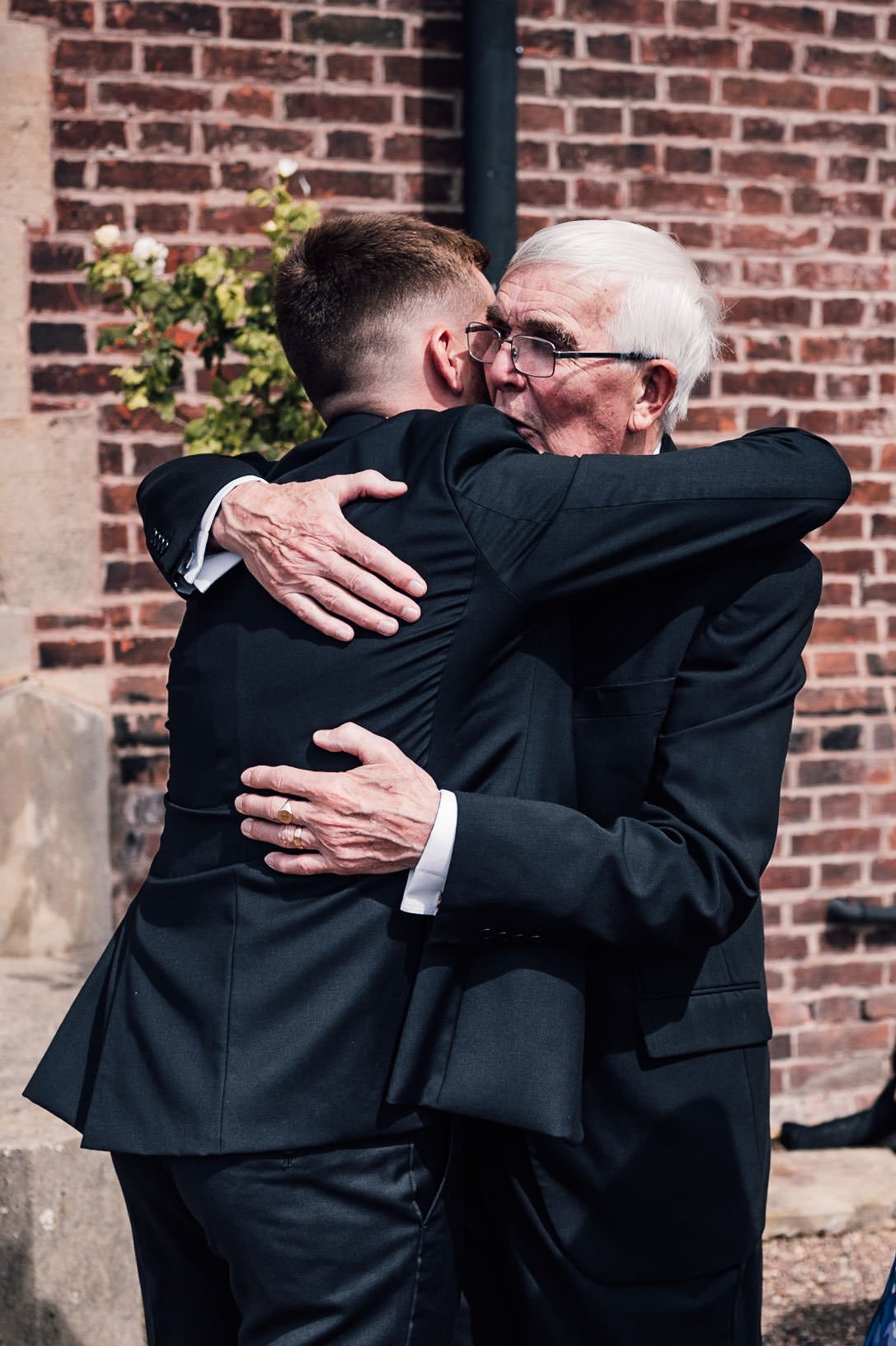 Groom hugging his Grandpa at Hodsock Priory