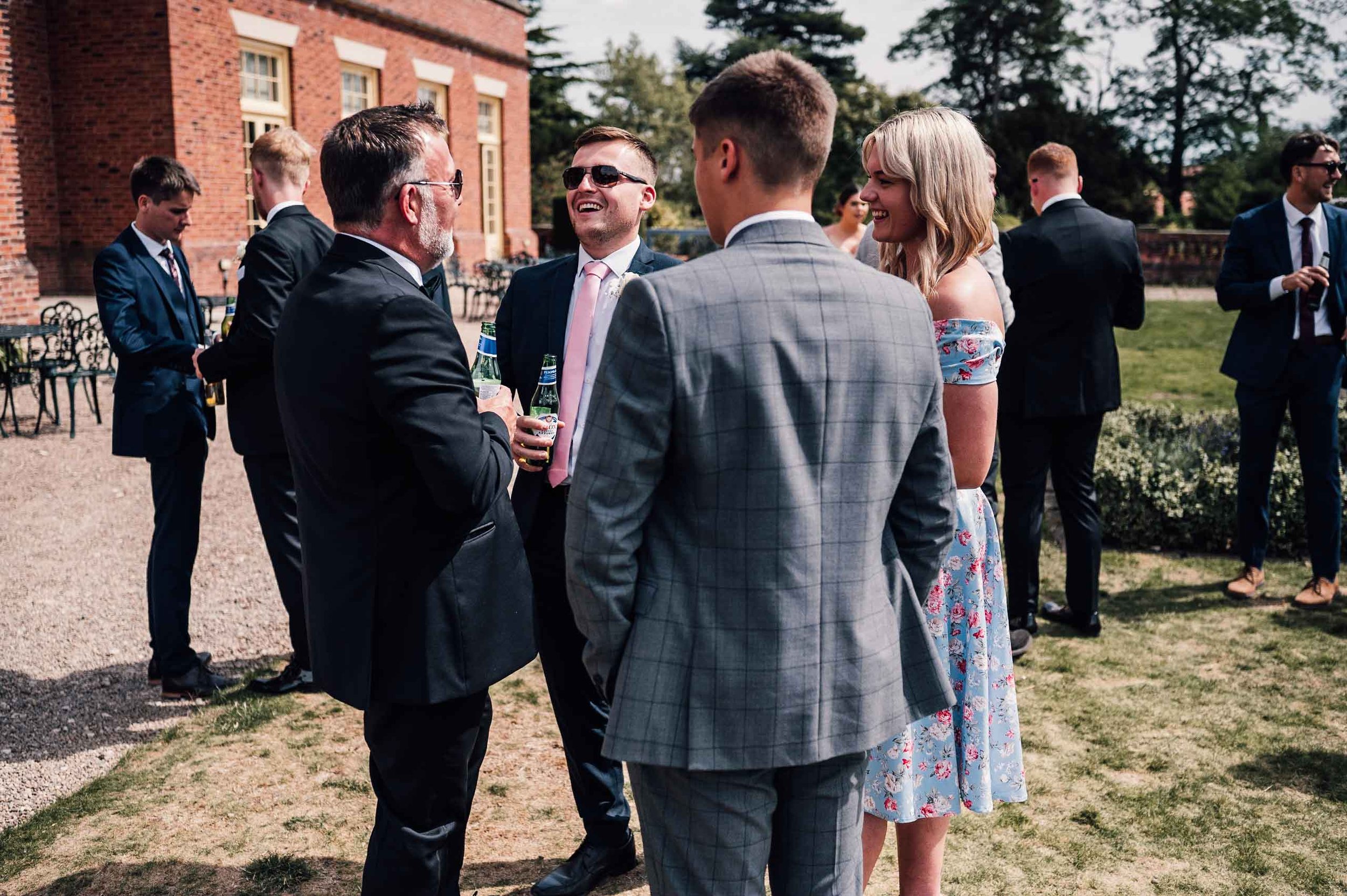 Wedding guests sharing a joke