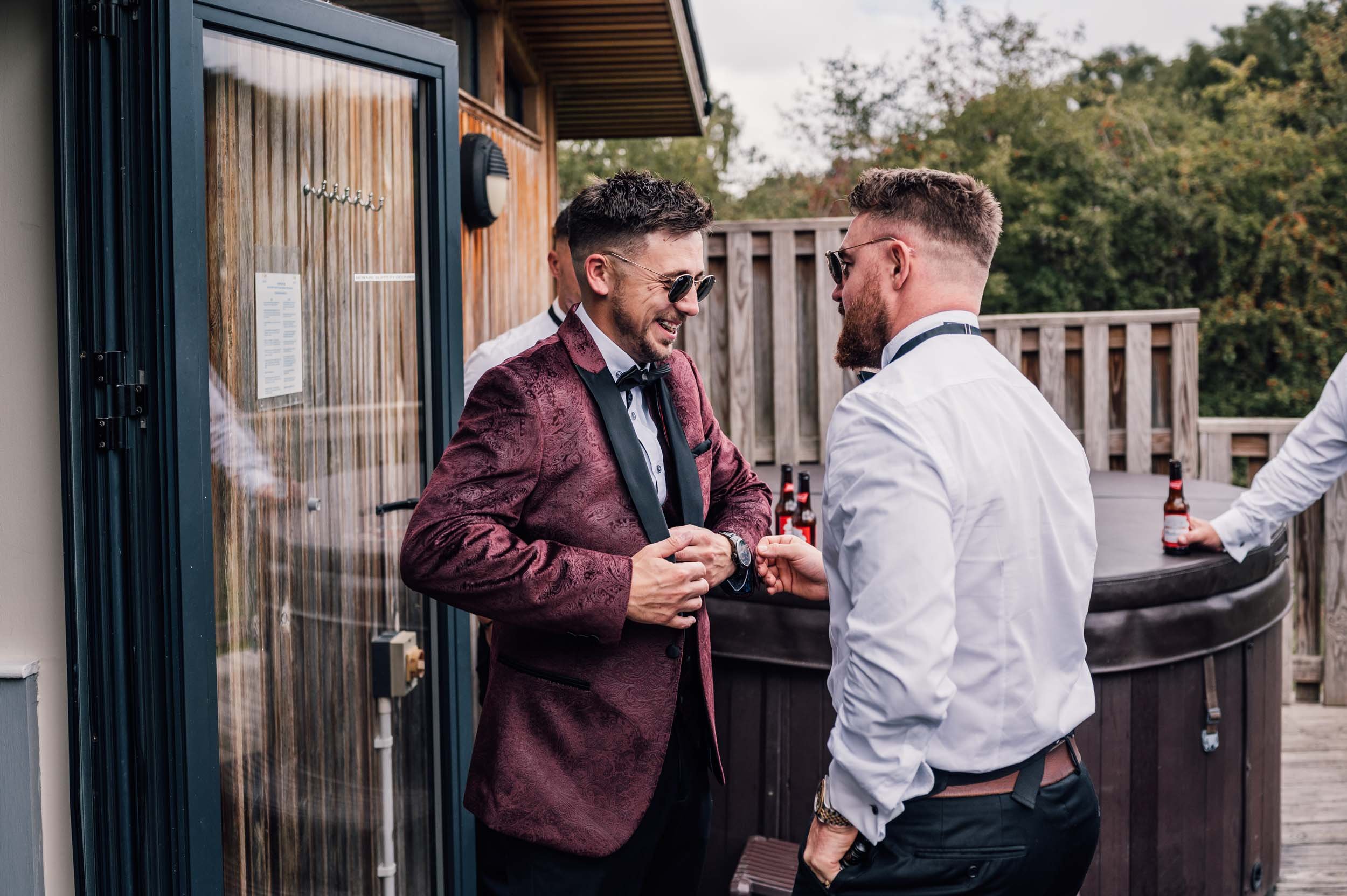 groom and bestman sharing a joke
