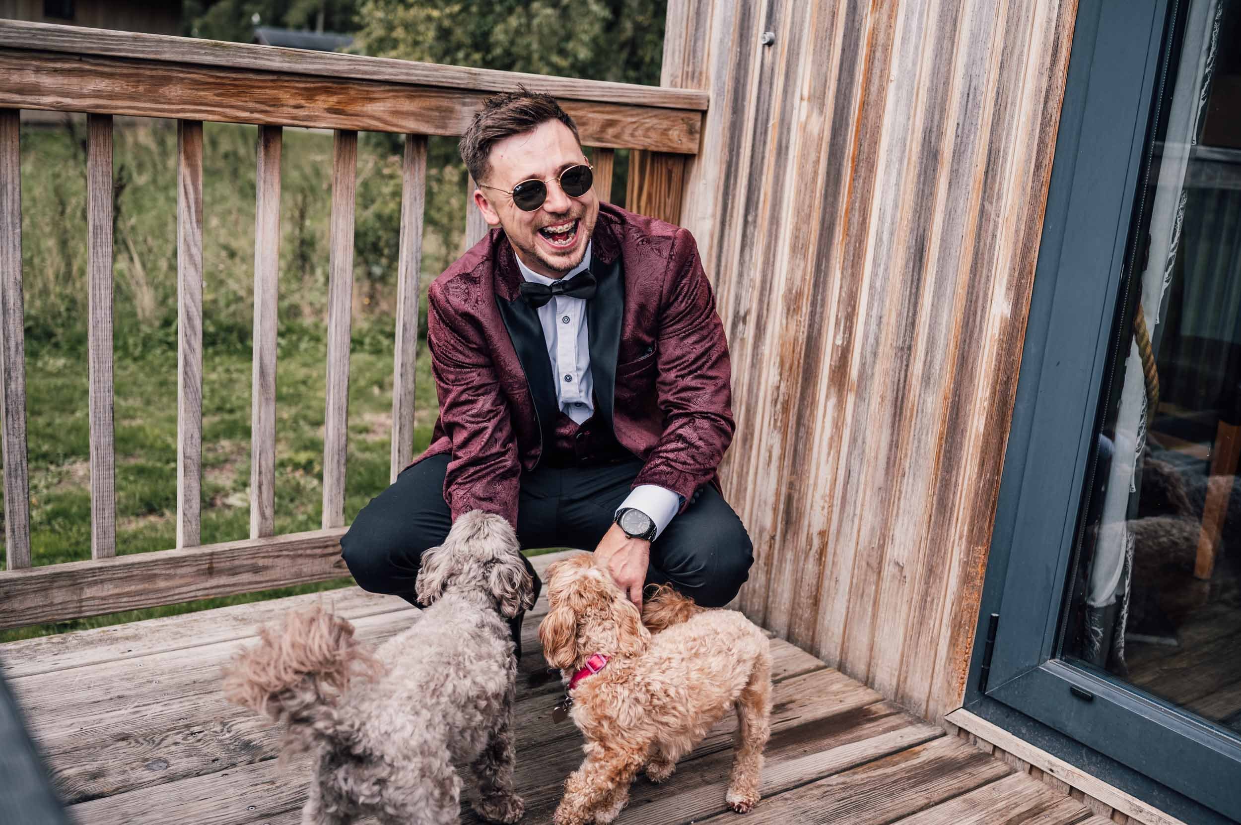 groom with his dogs