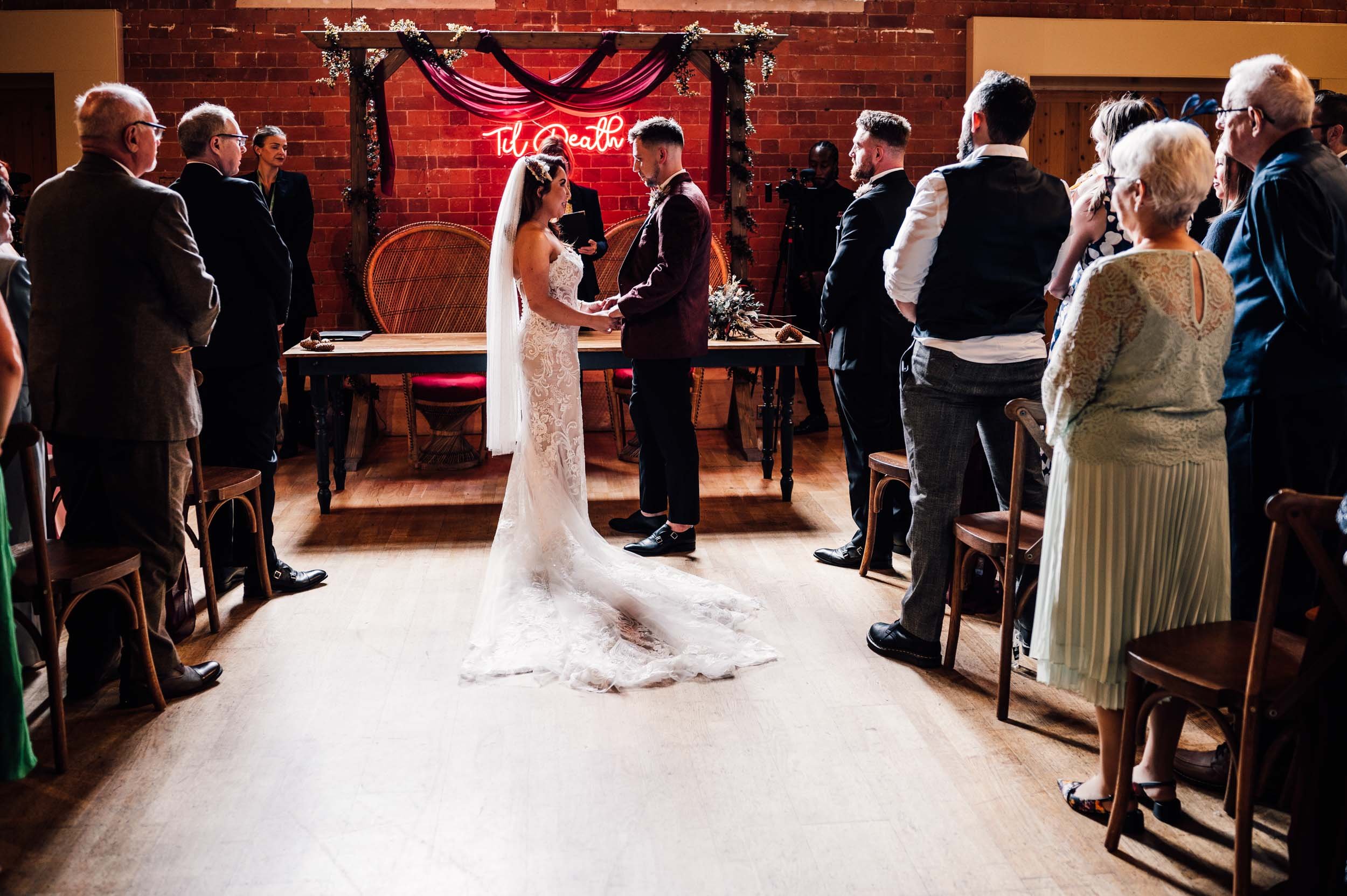 bride and groom getting married at Thoresby Riding Hall