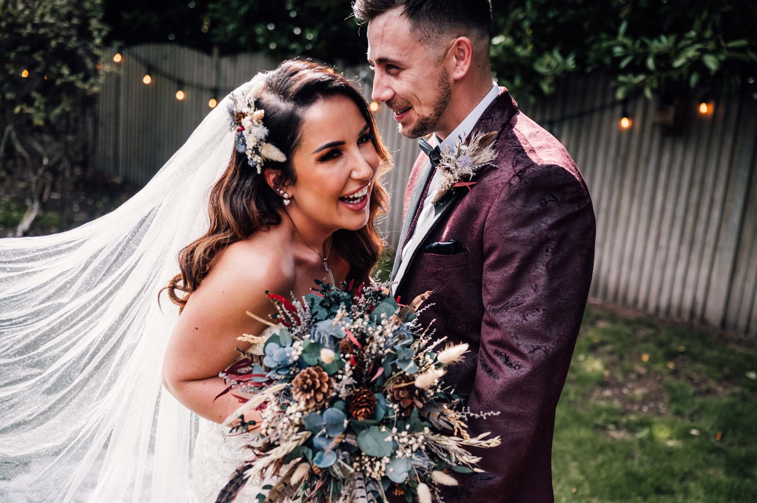 bride and groom laughing