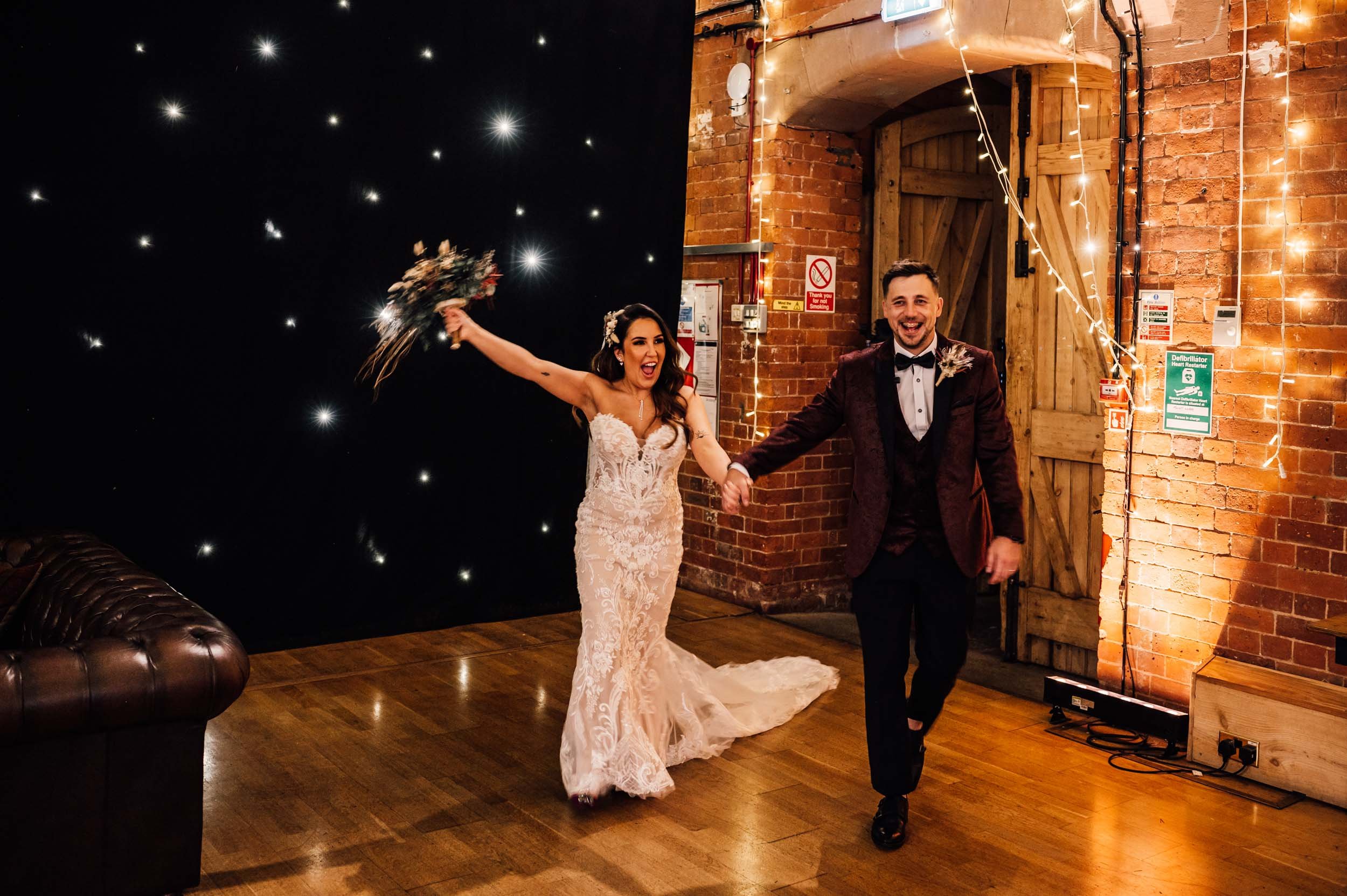 bride and groom enter the reception room at Thoresby Riding Hall
