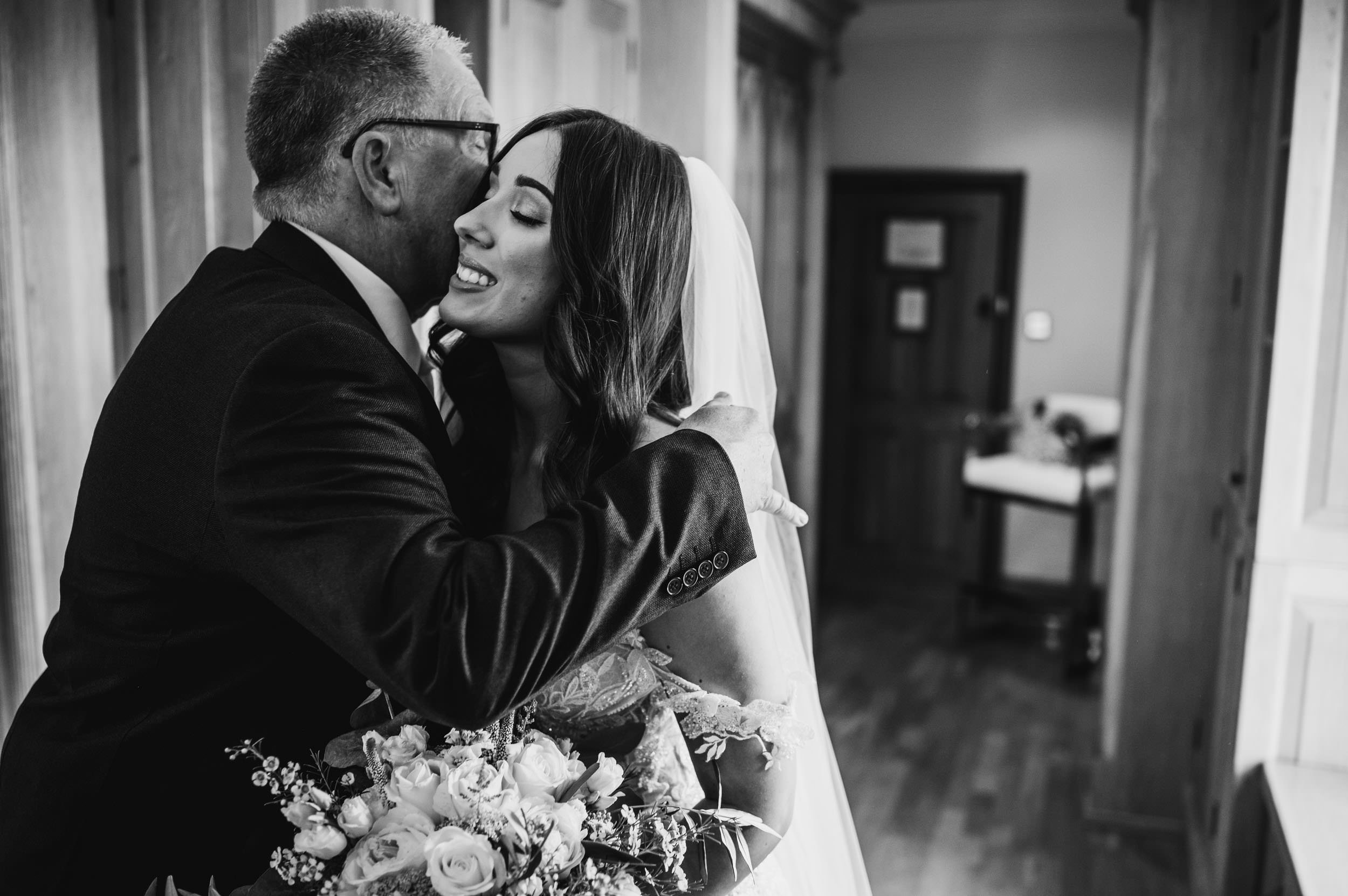 bride and dad hugging