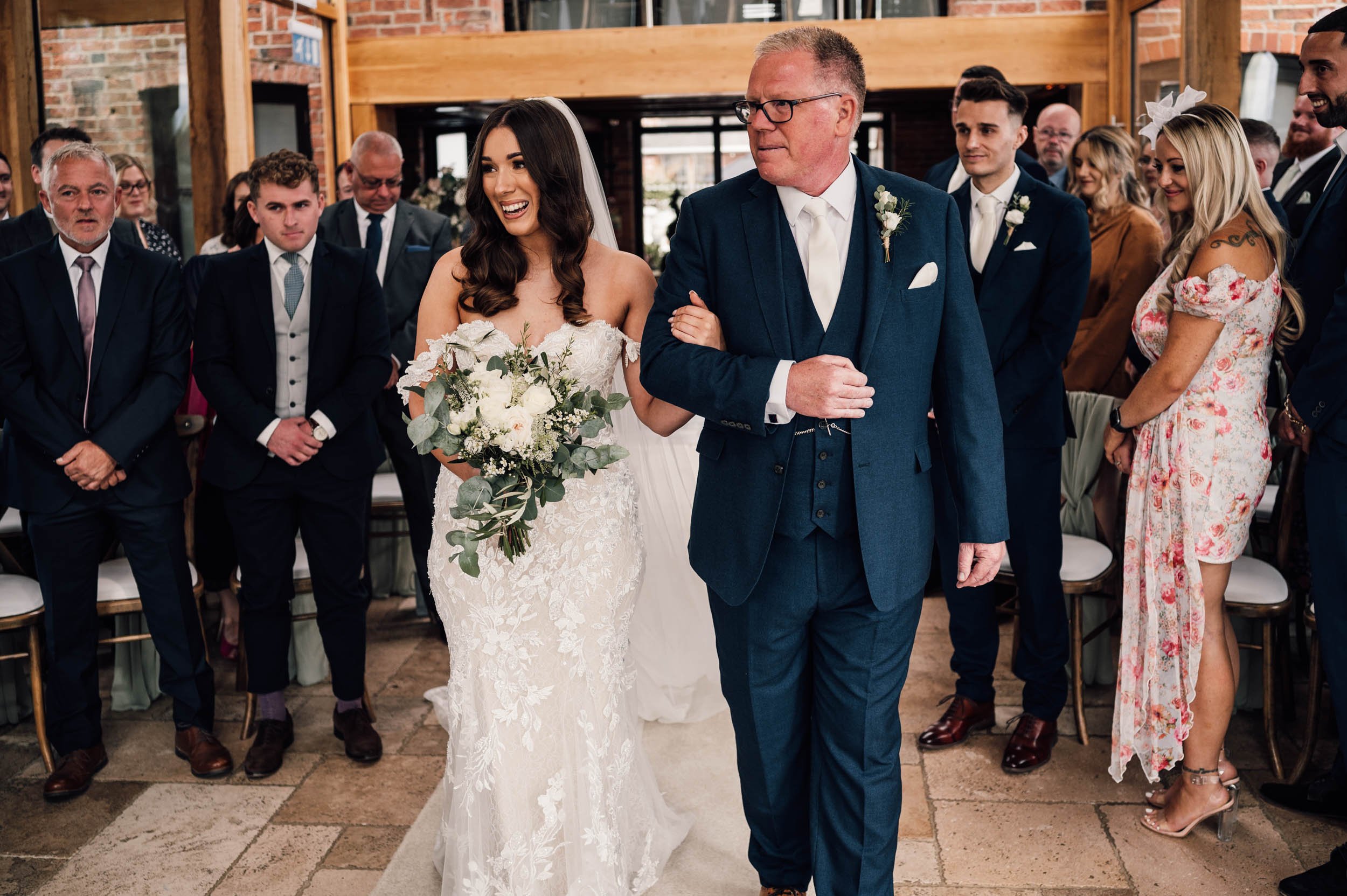 bride and her dad walking down the aisle