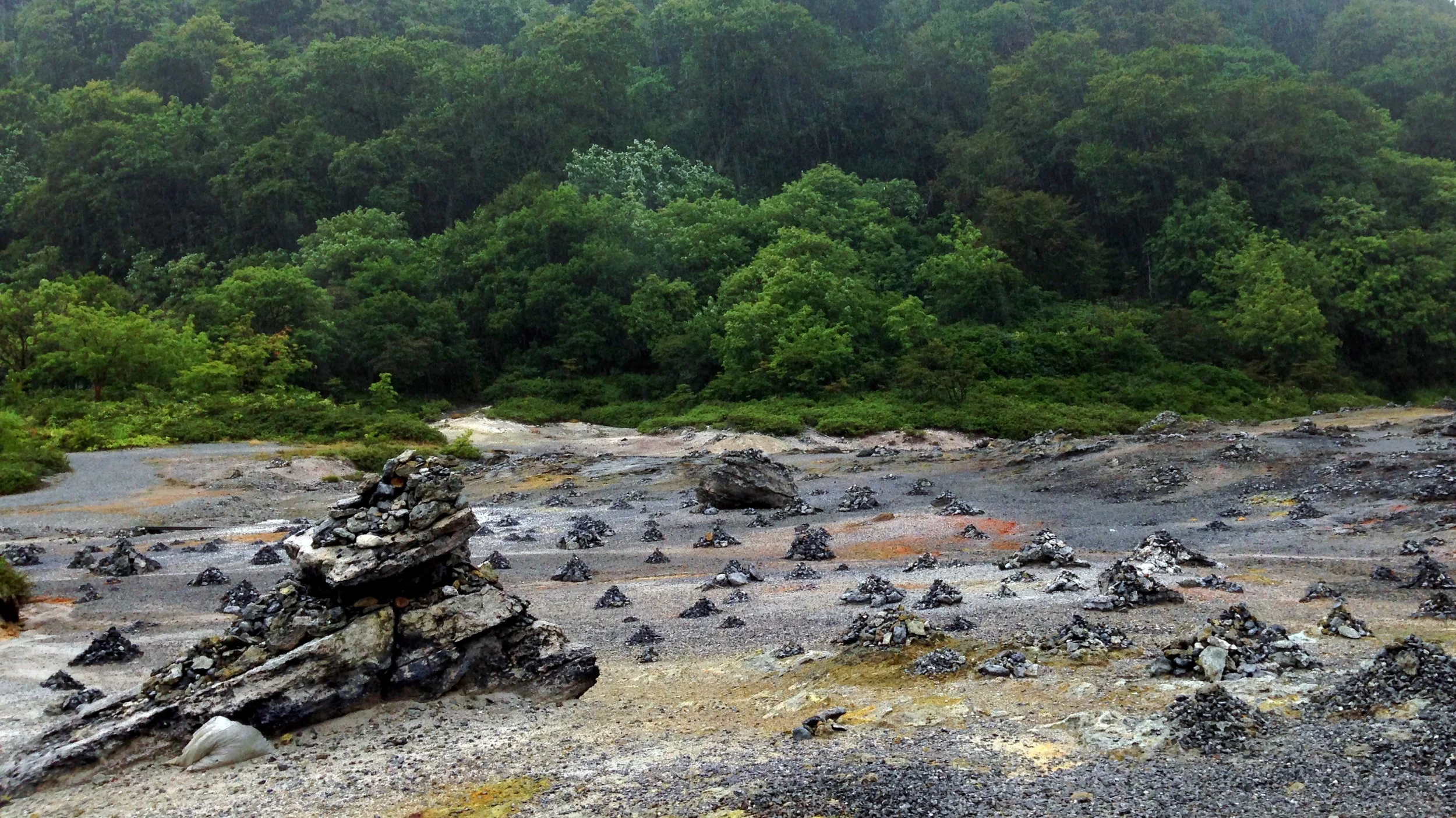 Heavenly greenery meets hellish rockscape at the temple grounds of Osorezan.