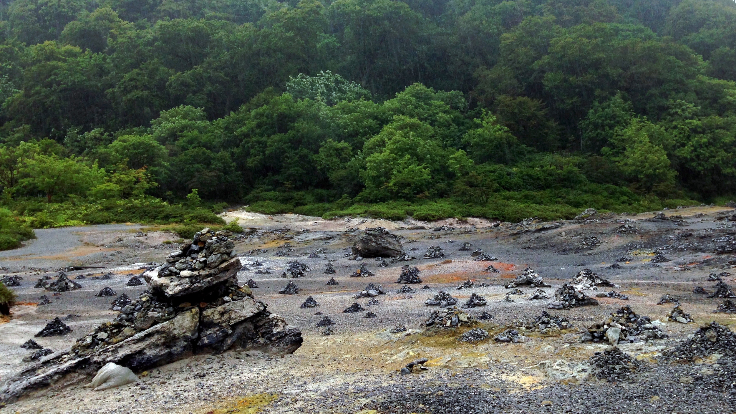 Heavenly greenery meets hellish rockscape at the temple grounds of Osorezan.