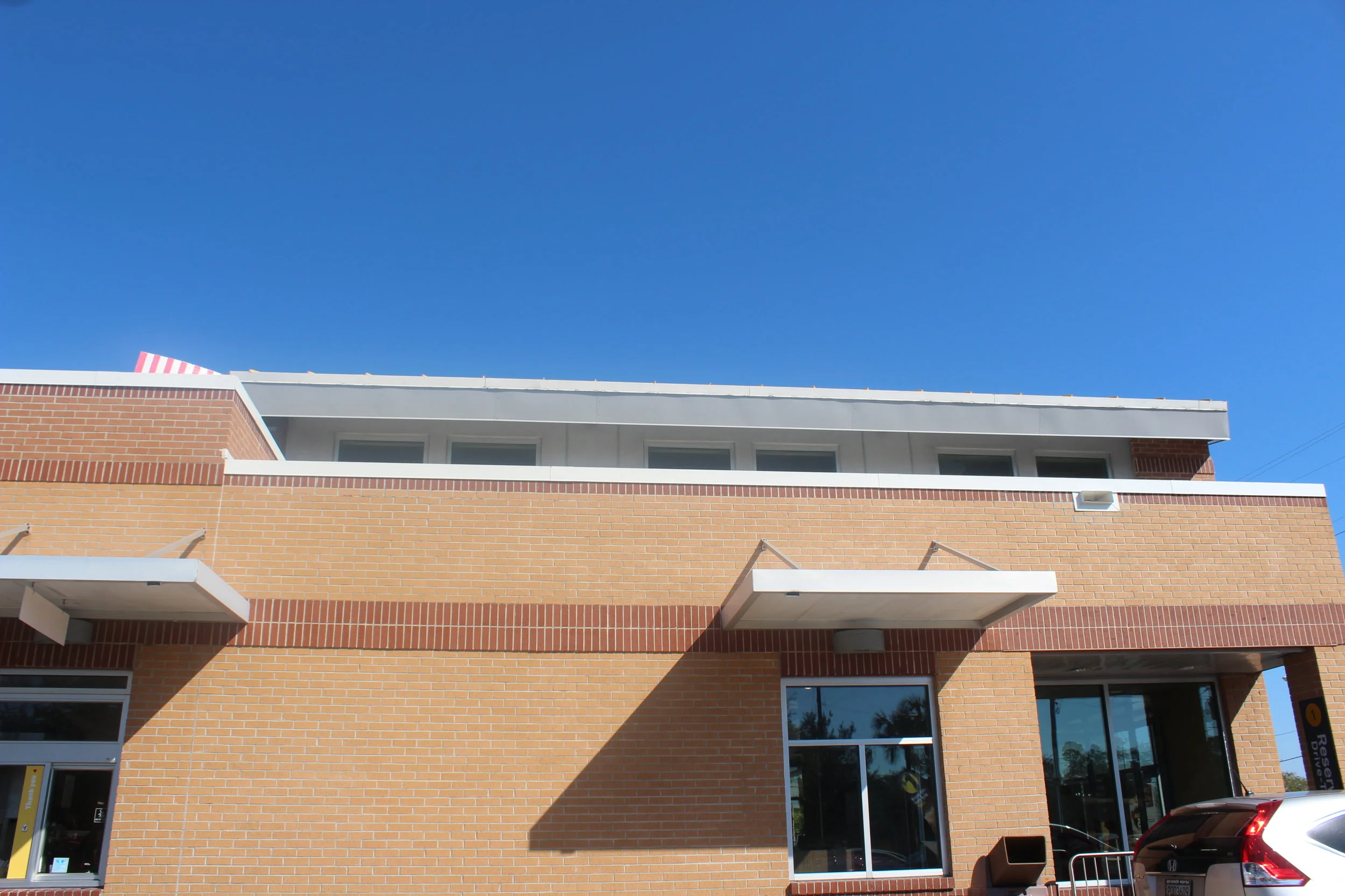 White 'cool' roof- proud to say we found this design feature implemented throughout the entire Abercorn Common Retail Development- white roofing everywhere!