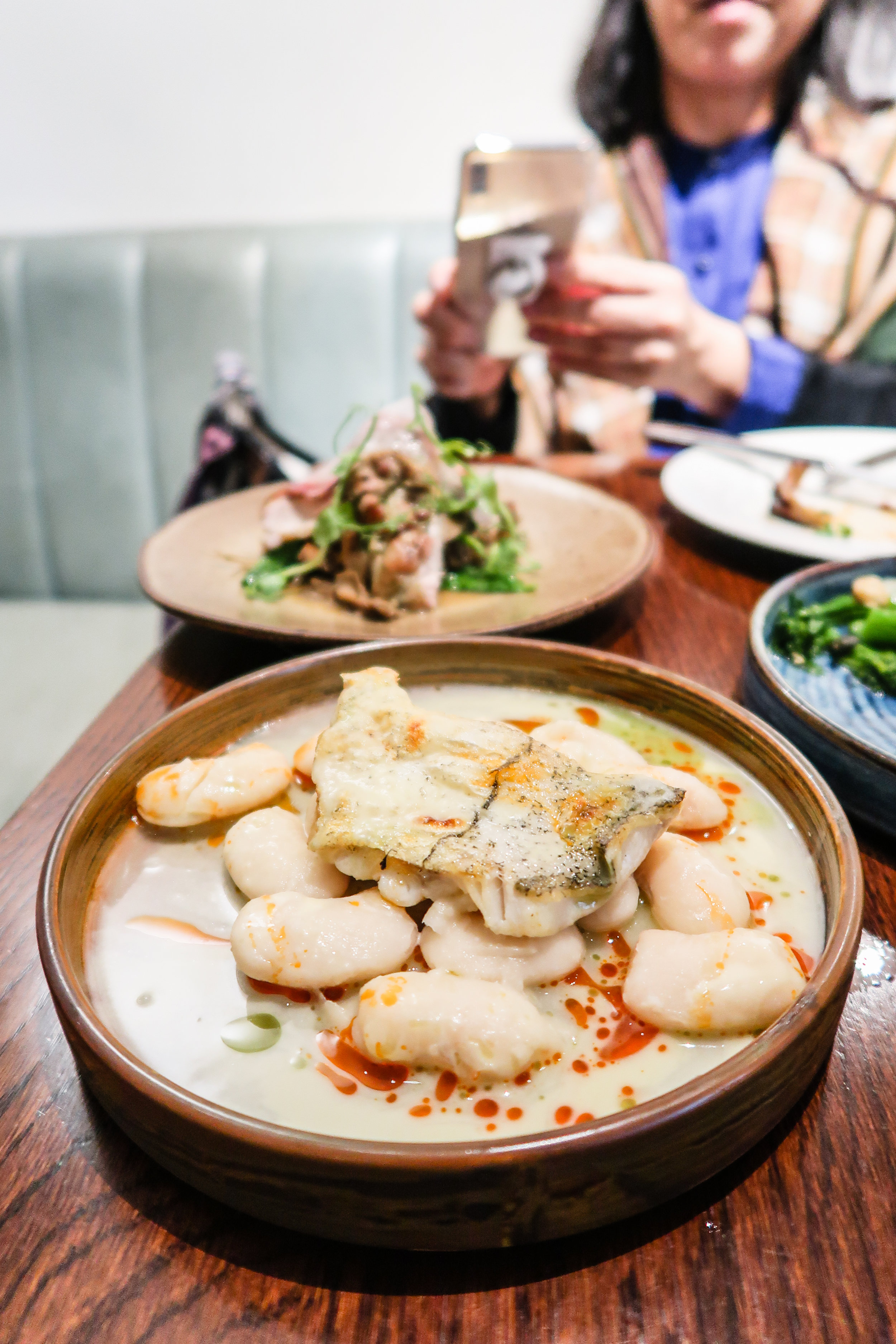 Baked haddock, butter beans, herbs oil