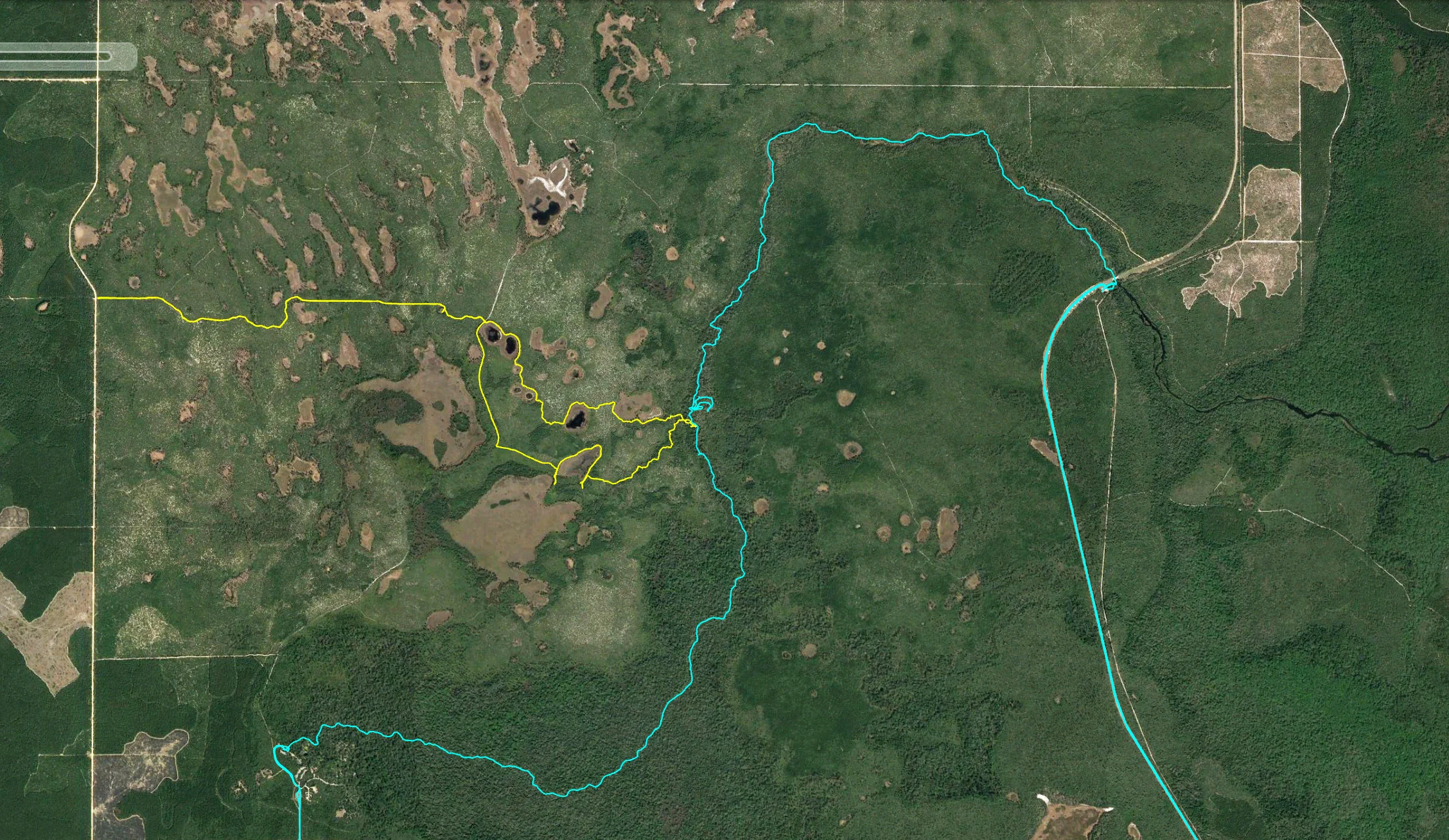Here is a Google Earth screenshot of our two trips, which I recorded with my Garmin. The blue path is from our kayaking scouting trip. The yellow path is from mine and Alex’s most recent trip where we navigated to the river via land.