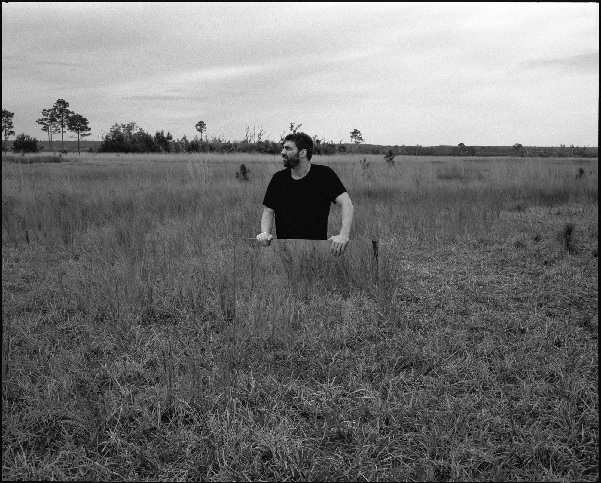 Alex disappearing behind the mirror in between photos at the Juniper Prairie Wilderness. Mamiya 7ii, 80mm, Kodak Tri-X 400 pushed to 1600.