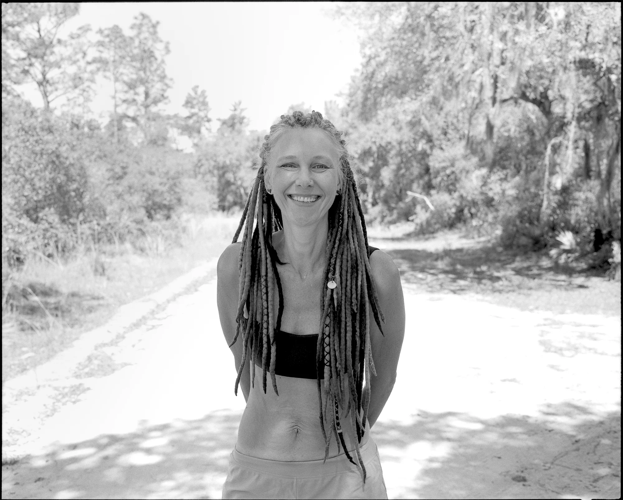 Krysten Nelson smiles for a portrait at the Pat’s Island Trailhead parking lot. You can follow her Instagram account @thehennahighway . Shot details: Mamiya 7ii, 80mm f/4, Kodak Tri-X 400 pushed to 1600