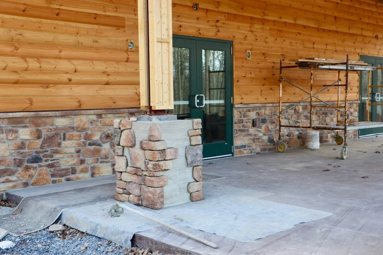 March 10 - Porch post stonework begins