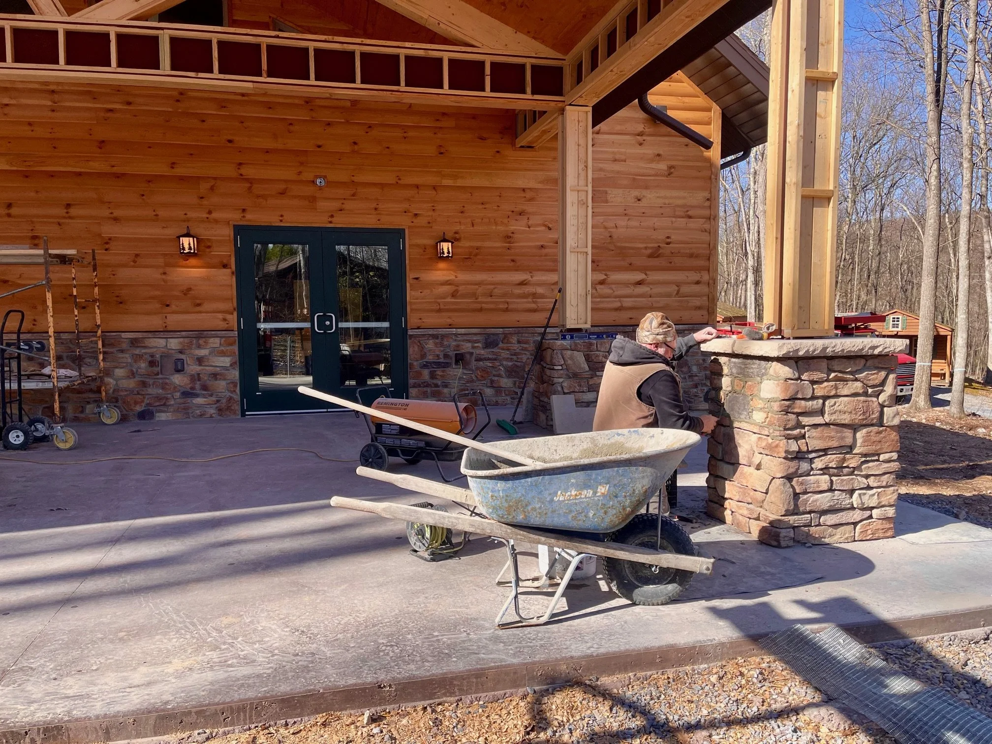 March 23 - Porch post stonework finishing up