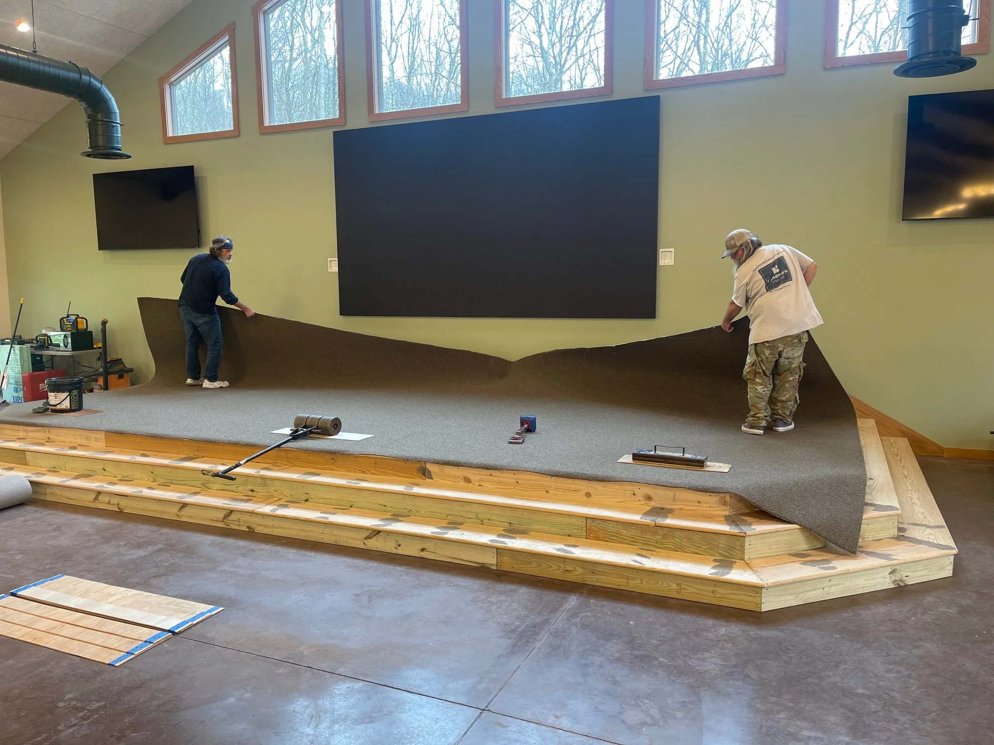 April 13 - Stage carpet install begins (and completed video wall!)