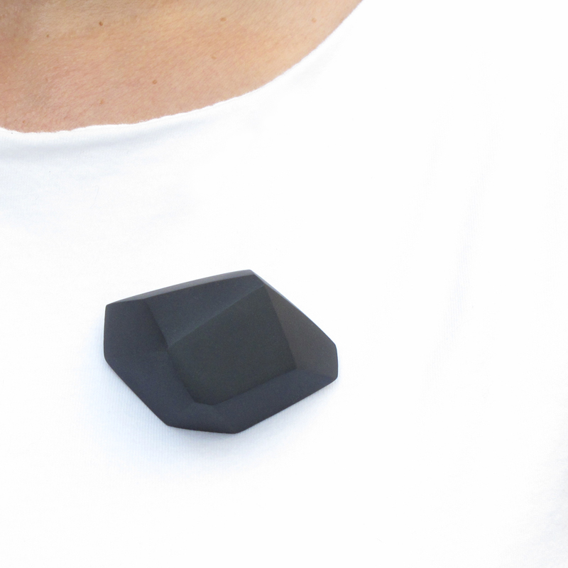  Aggregate/Wearable   Cast vitreous porcelain with silver findings. Largest Pin is 2"W × 1"H × 0.5"D Colors: white, black, pale gray, deep grey and blue.  A collection of bold yet lightweight pins and pendants.&nbsp; Pins are available in large, med