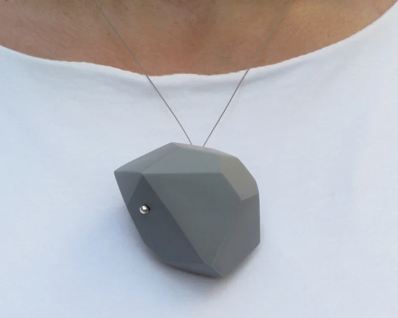   Aggregate/Wearable   Cast vitreous porcelain with silver findings. Largest Pin is 2"W × 1"H × 0.5"D Colors: white, black, pale gray, deep grey and blue.  A collection of bold yet lightweight pins and pendants.&nbsp; Pins are available in large, med