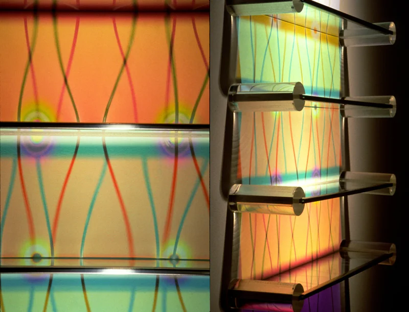   Aurora Shelving - Wave Pattern   Etched + Laminated Glass + Steel/Acrylic Supports Various Dimensions  Glass shelving that   literally  paints  the wall with colored reflections when illuminated by a spotlight from above. There are no visible color