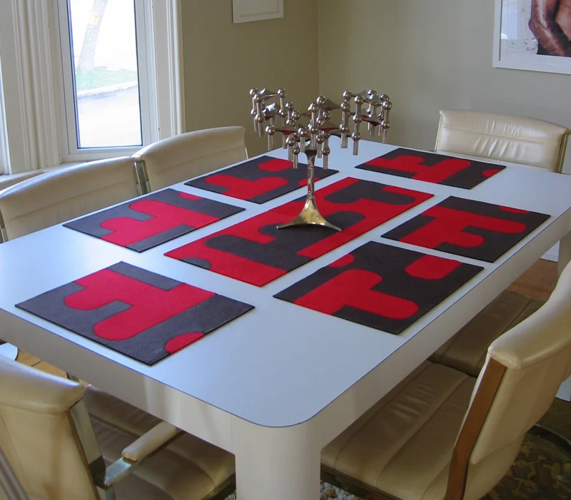   Bridget Placemats   Stitched 20LB Felt 16”L X 12” W each  The mats can be used to distinguish individual place settings or grouped together to create a table runner or center piece. Each mat is reversible and finished on both sides to maximize the 