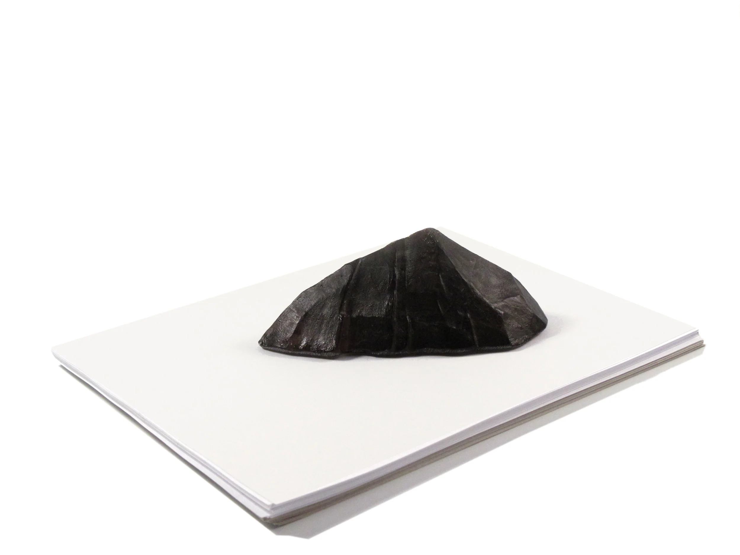   Munro Series - Furth  Paperweight  Cast glass 6.25” L X 2.5” H X 3.25” D  Only one cast is made from each hand modeled clay form, making every Munro in the series unique. 