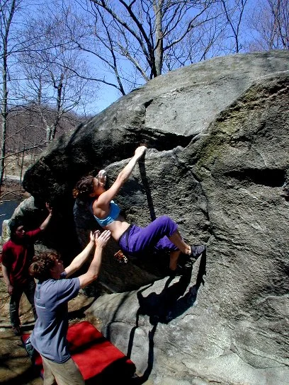Anne Skidmore nearing the topout of The Wave, at Lincoln Woods, RI. Photograph by Joe McLoughlin.