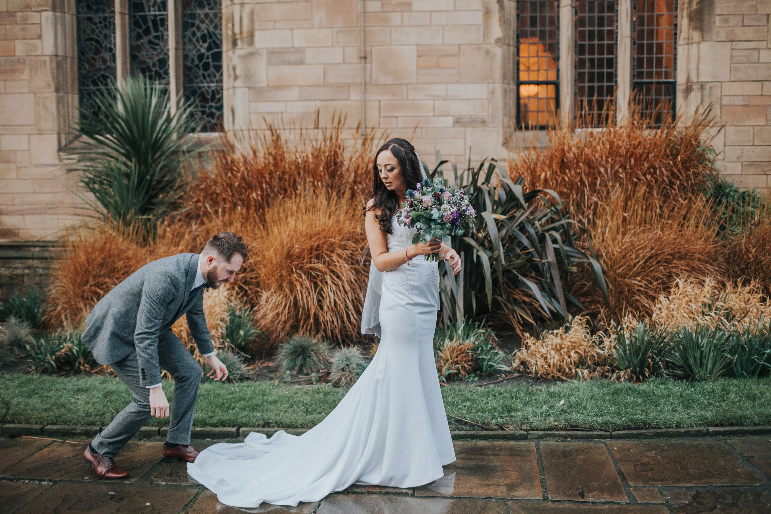 Groom fixes brides dress