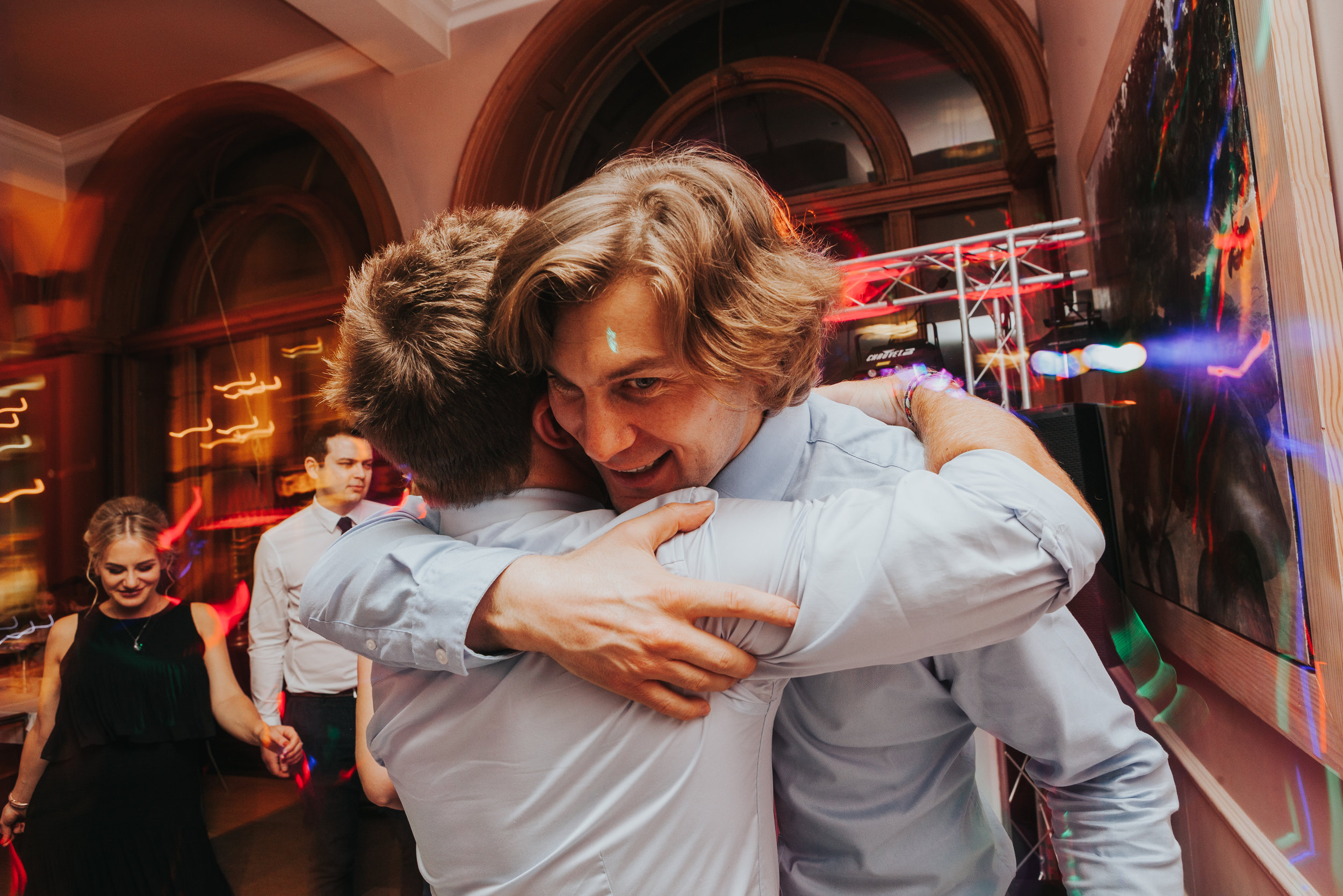 Guests hug