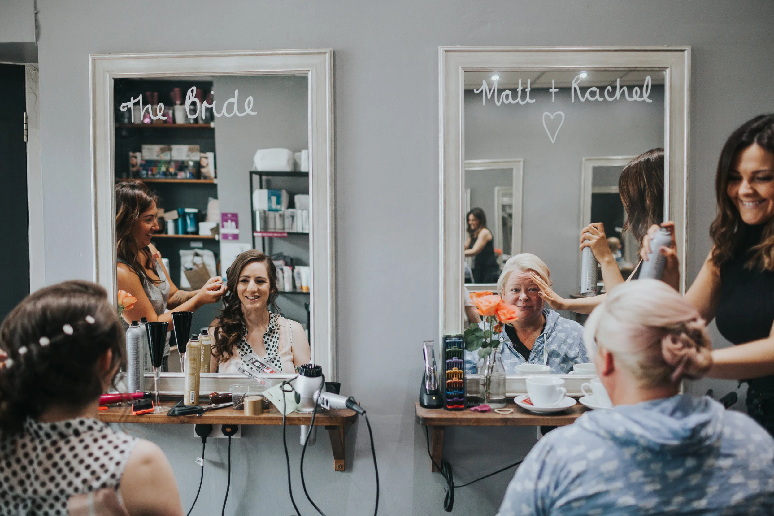  Bride and Maid of Honour get hair done, reflections in mirrors 