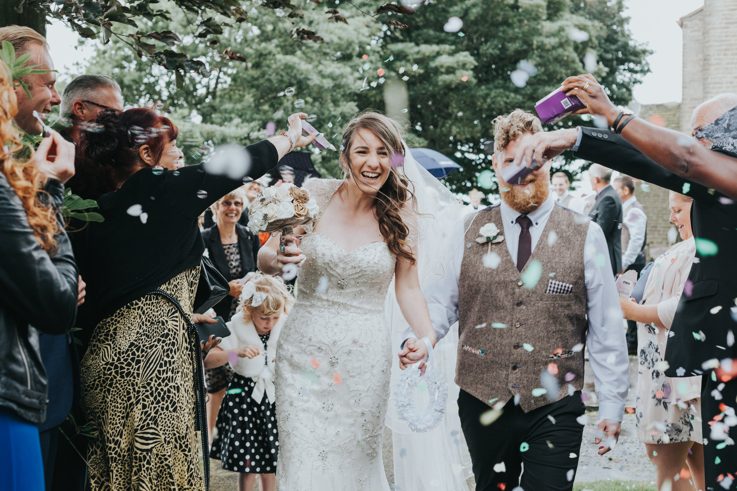  New Weds are attacked with confetti.&nbsp; 