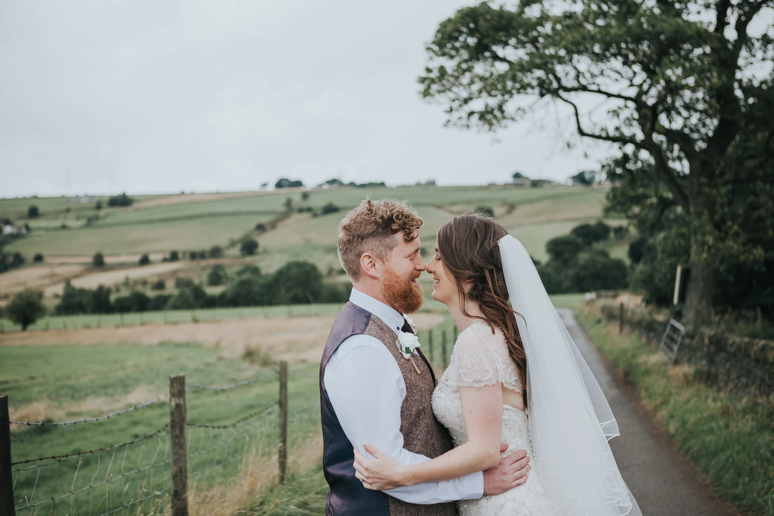  Bride and Groom portrait over rolling hills 