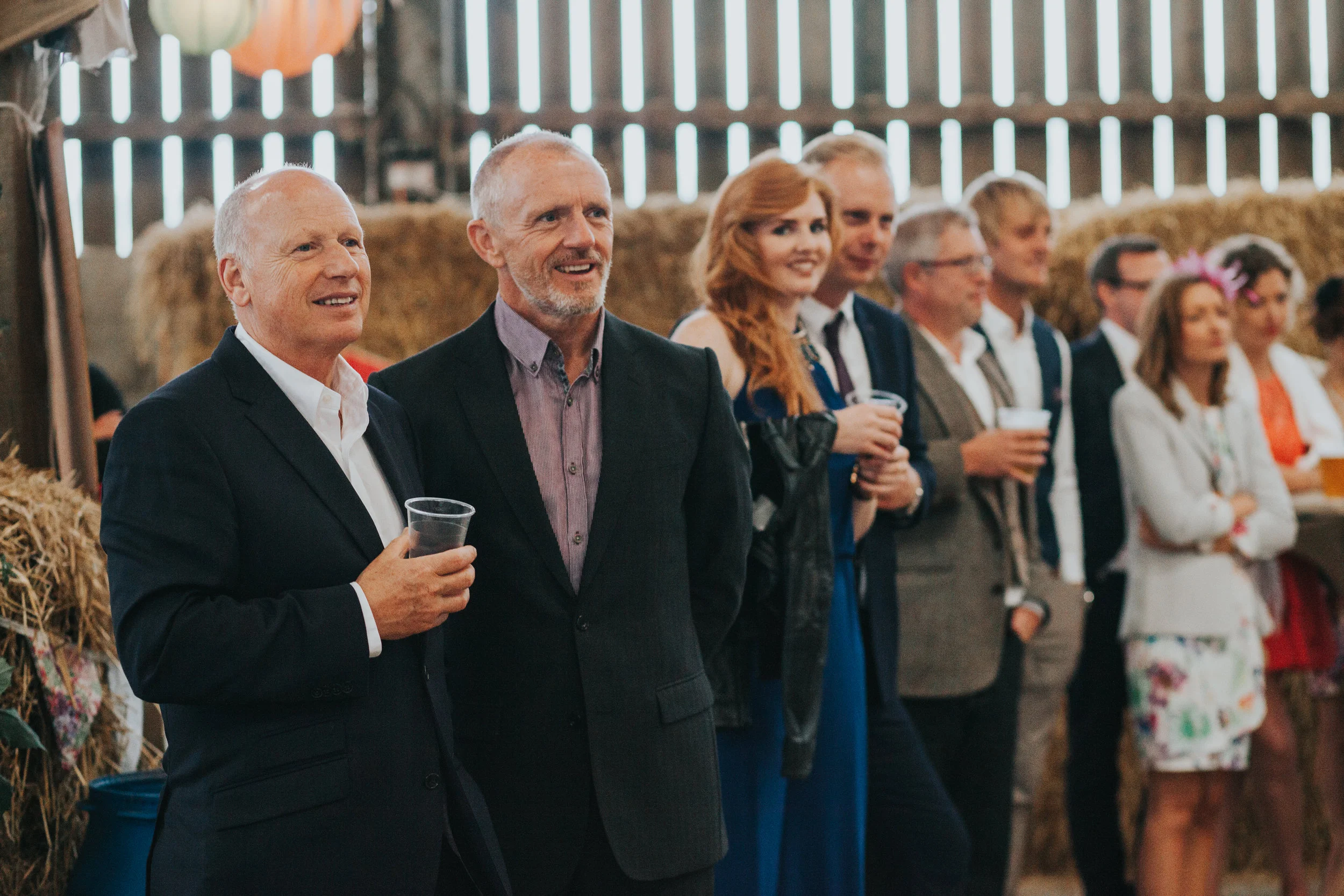  Guests listening holding drinks 