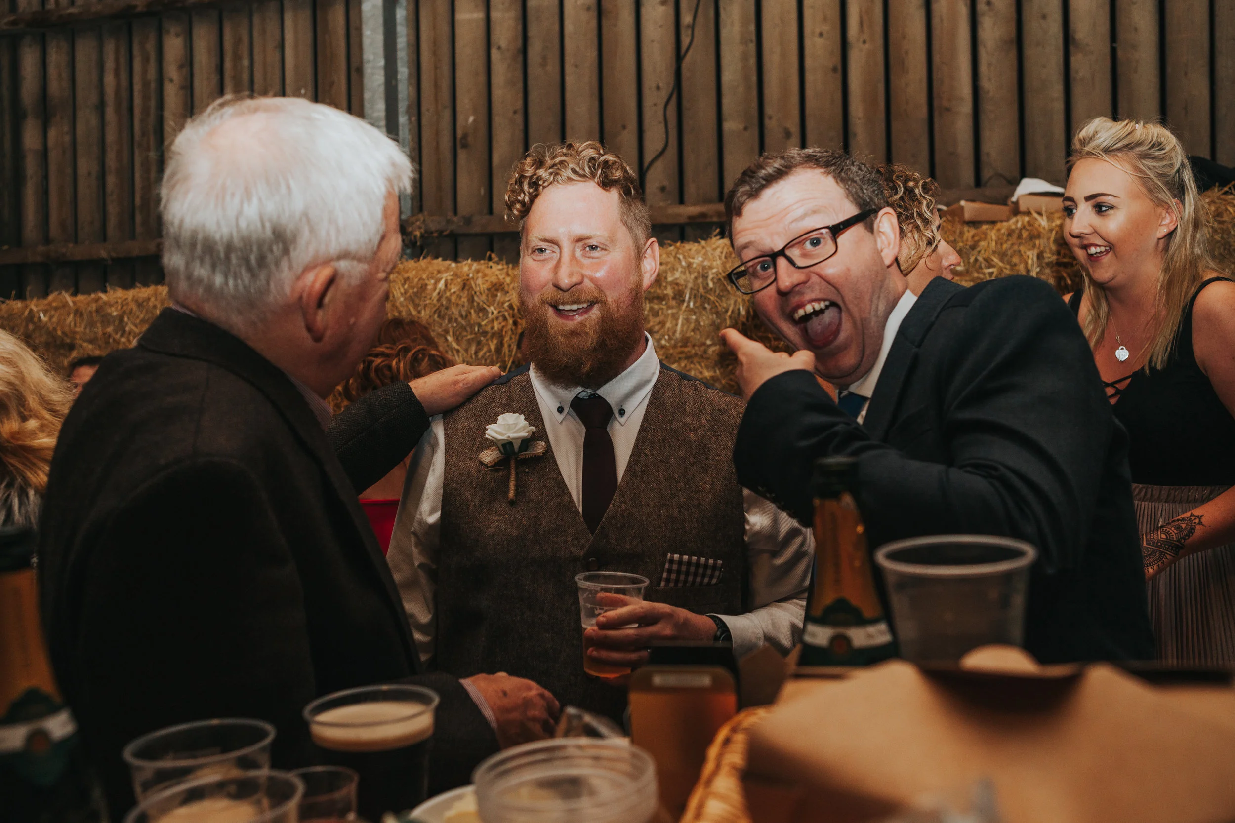  Guest points at groom looking excited 
