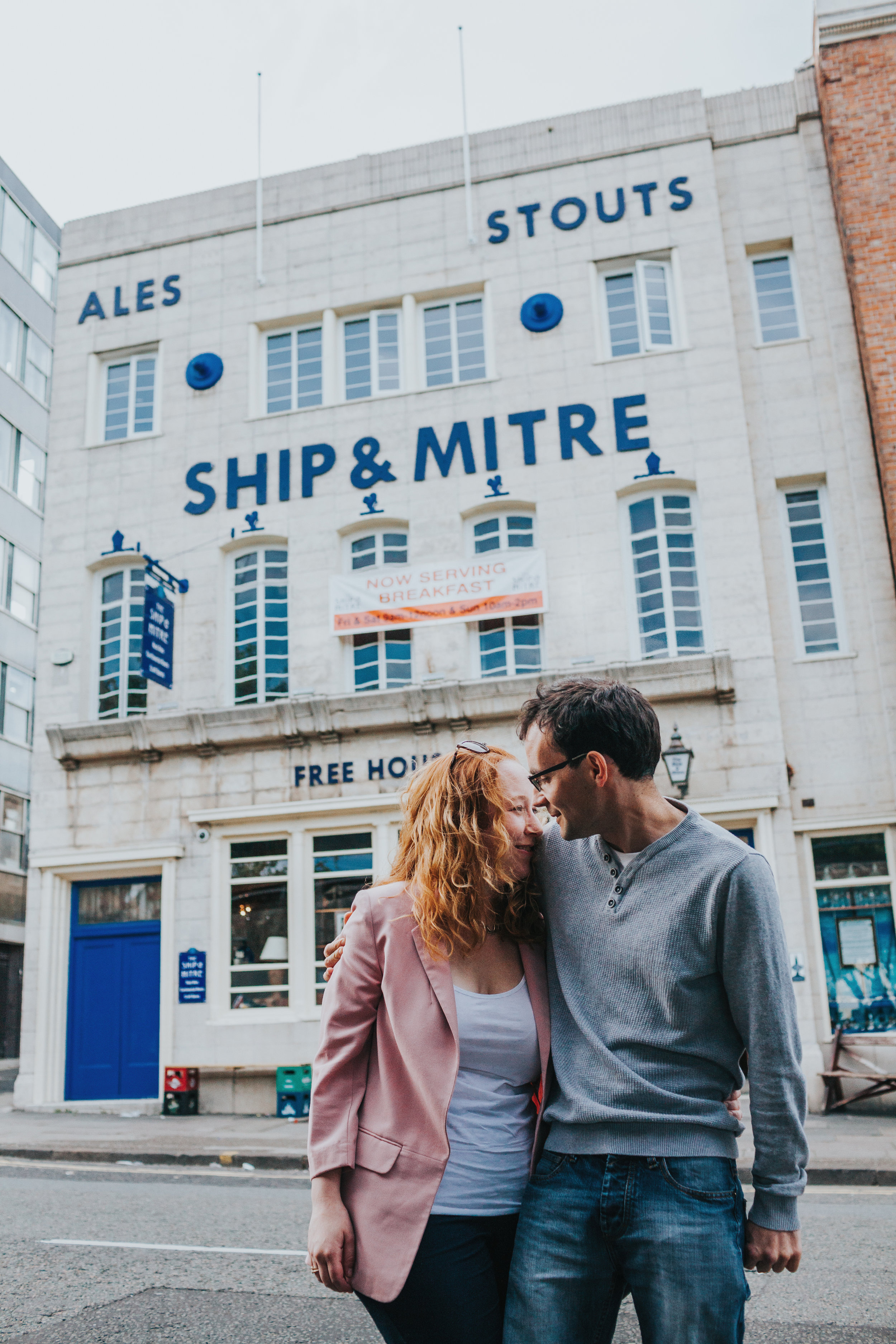 Couple laughing outside pub