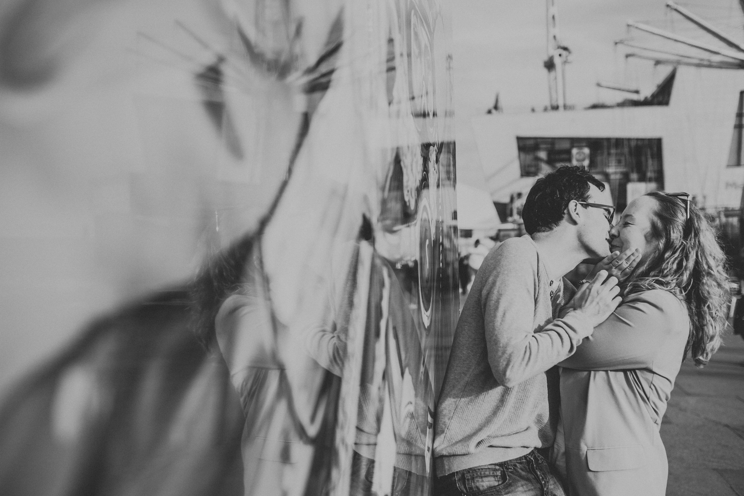 Mural leading to couple kissing, black and white.