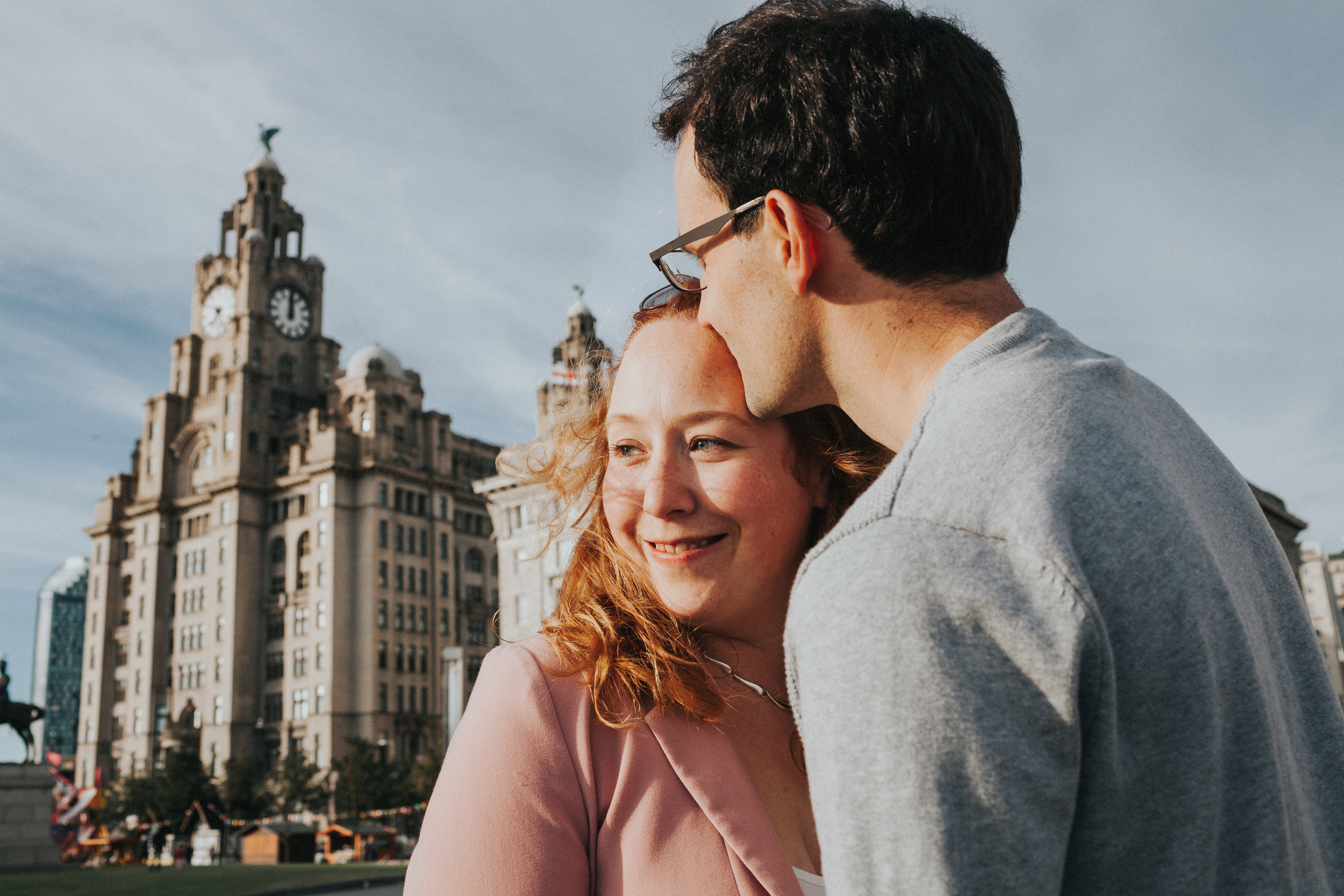 Couple in front of Liver Buildings smiling