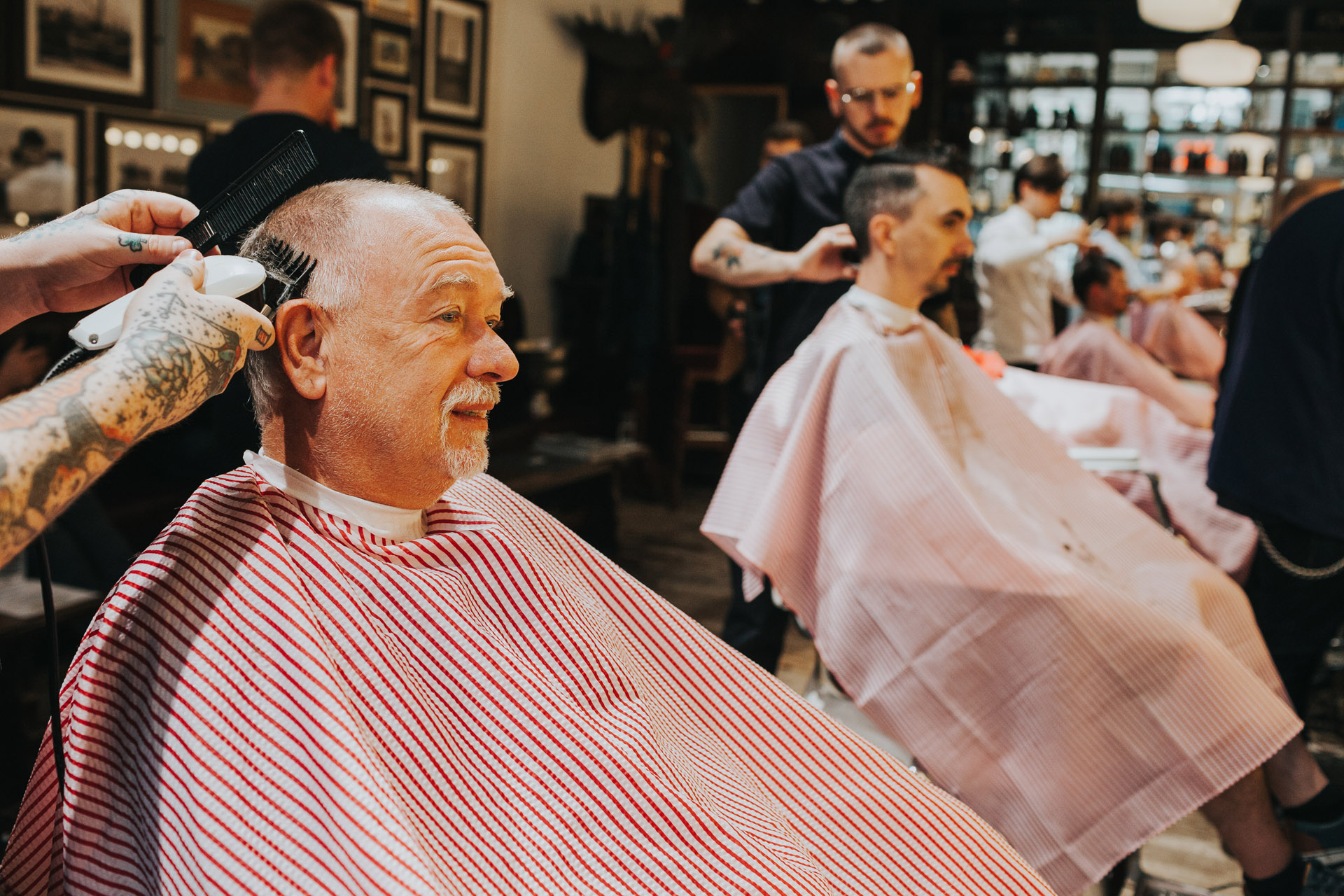 Groomsman getting hair cut with clippers, Manchester