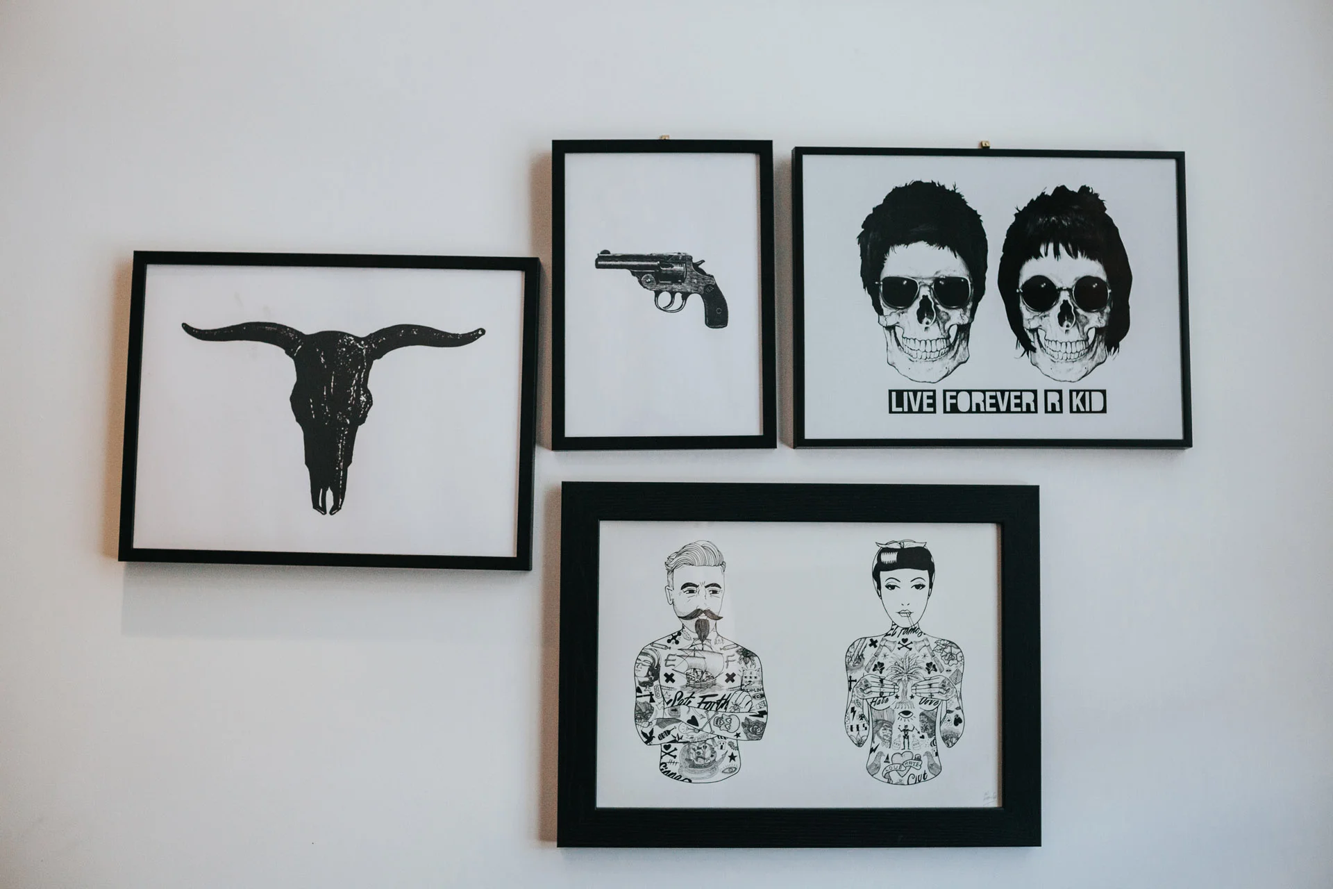 Black and white pictures on the wall of the bride and grooms home in Manchester