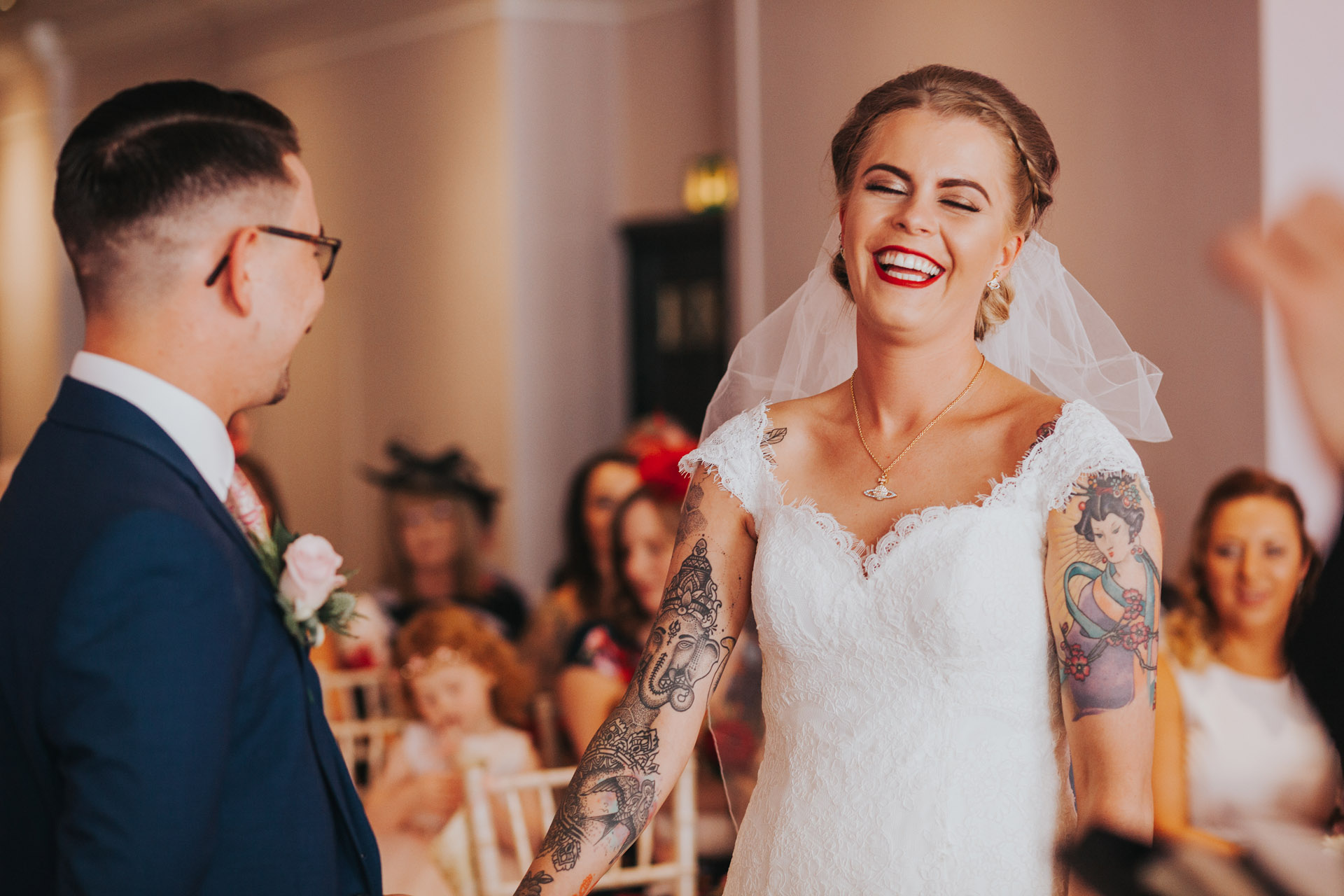 Bride laughs. 